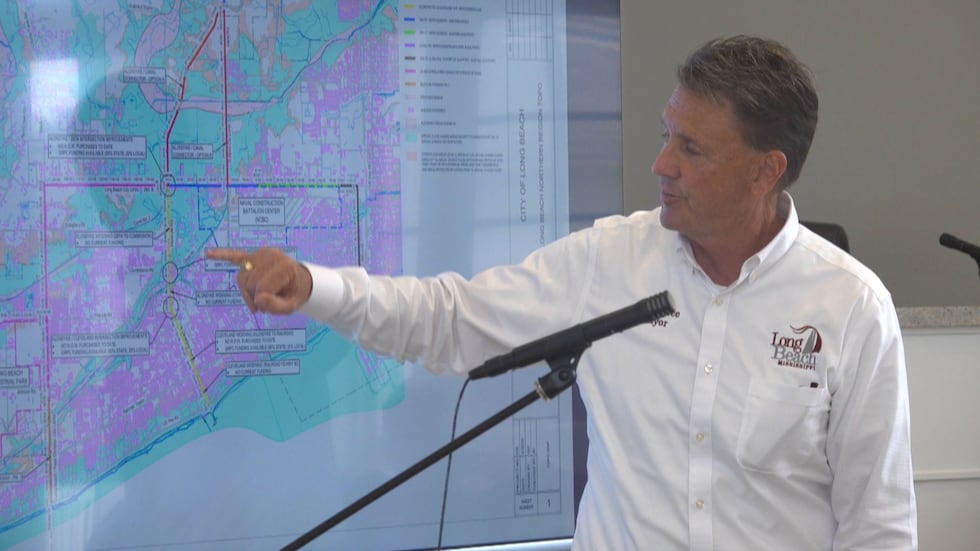 Mayor Tim Pierce explained the North-South Corridor Project during a work session at Long...