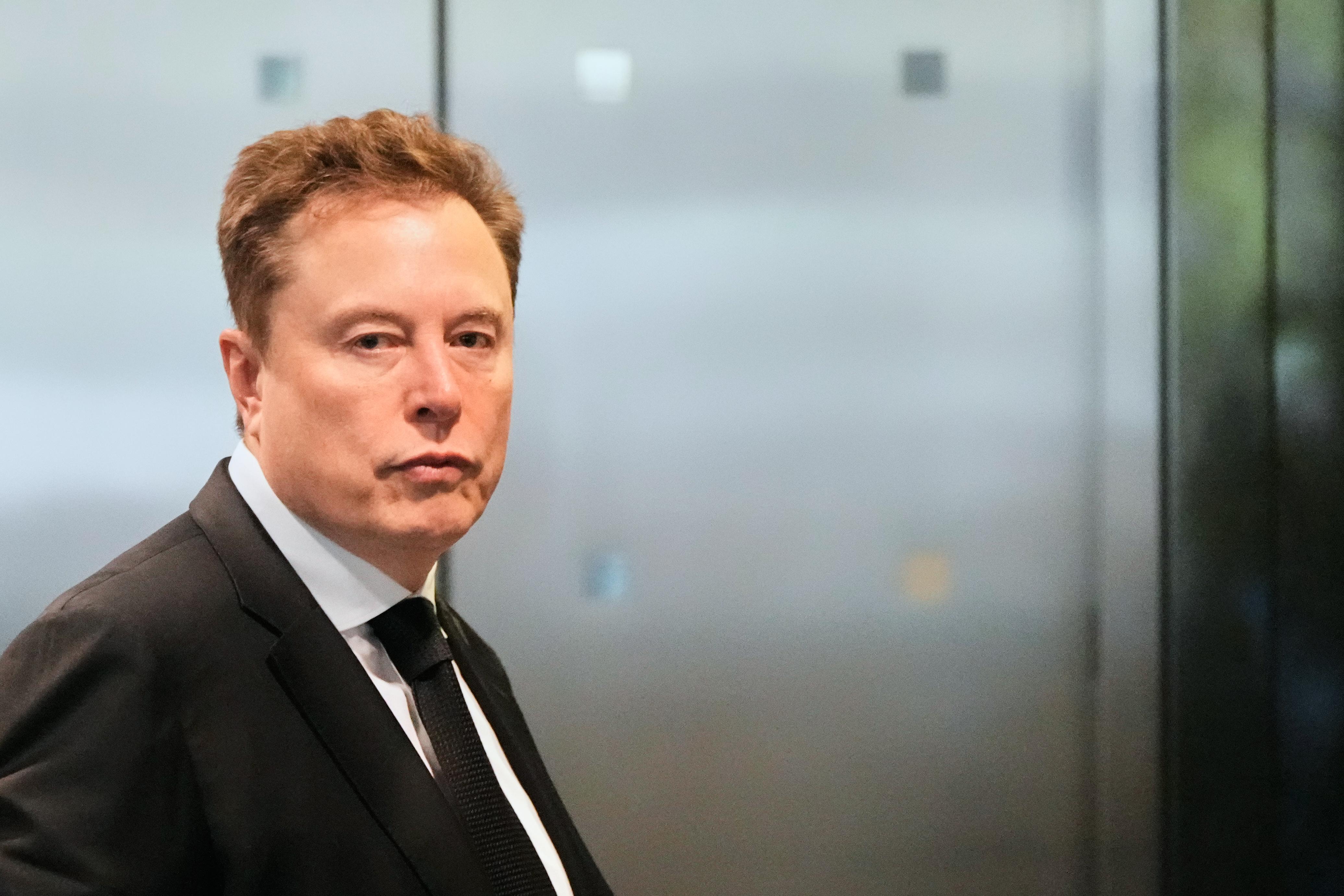 Elon Musk arrives at the U.S. District Court in Oakland,...