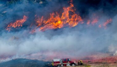 Pechanga Fire Department firefighters monitor the smoky and fast-growing wildfire Springs Fire in Moreno Valley, Calif., Friday, April 3, 2026. (Terry Pierson /The Orange County Register via AP)