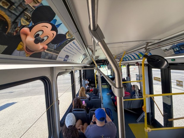 Bus riders take Anaheim Regional Transportation (ART) buses shuttles from the Toy Story parking lot to the Disneyland Resort on Thursday, January 29, 2026, in Anaheim, CA. The Anaheim Transportation Network's board voted Wed. Jan. 28 to "wind down" operations, with the last day of shuttling planned for March 31. The bus system moves 8 million riders a year around the resort area. (Photo by Jeff Gritchen, Orange County Register/SCNG)