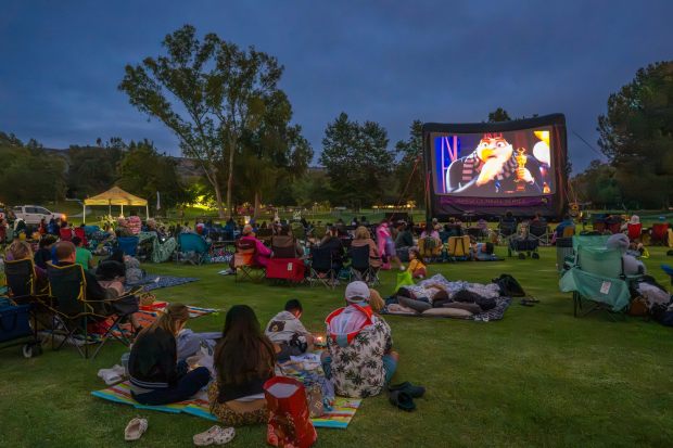 Families relax on the grass to watch a movie at Carbon Canyon Regional Park in Brea. (Photo by Leonard Ortiz, Orange County Register/SCNG)