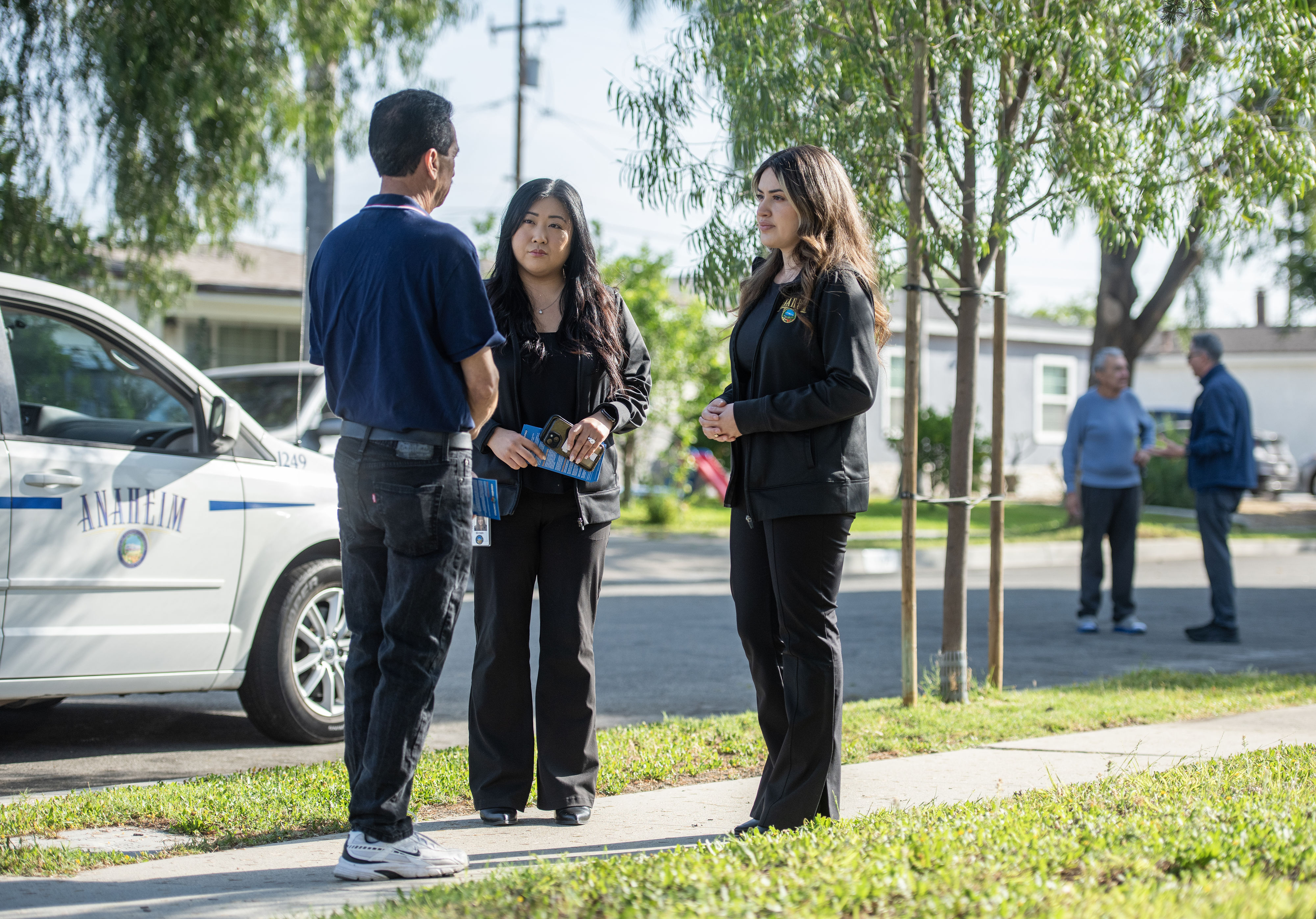 City of Anaheim Communications Specialists Esther Kwon, center, and Natalie...