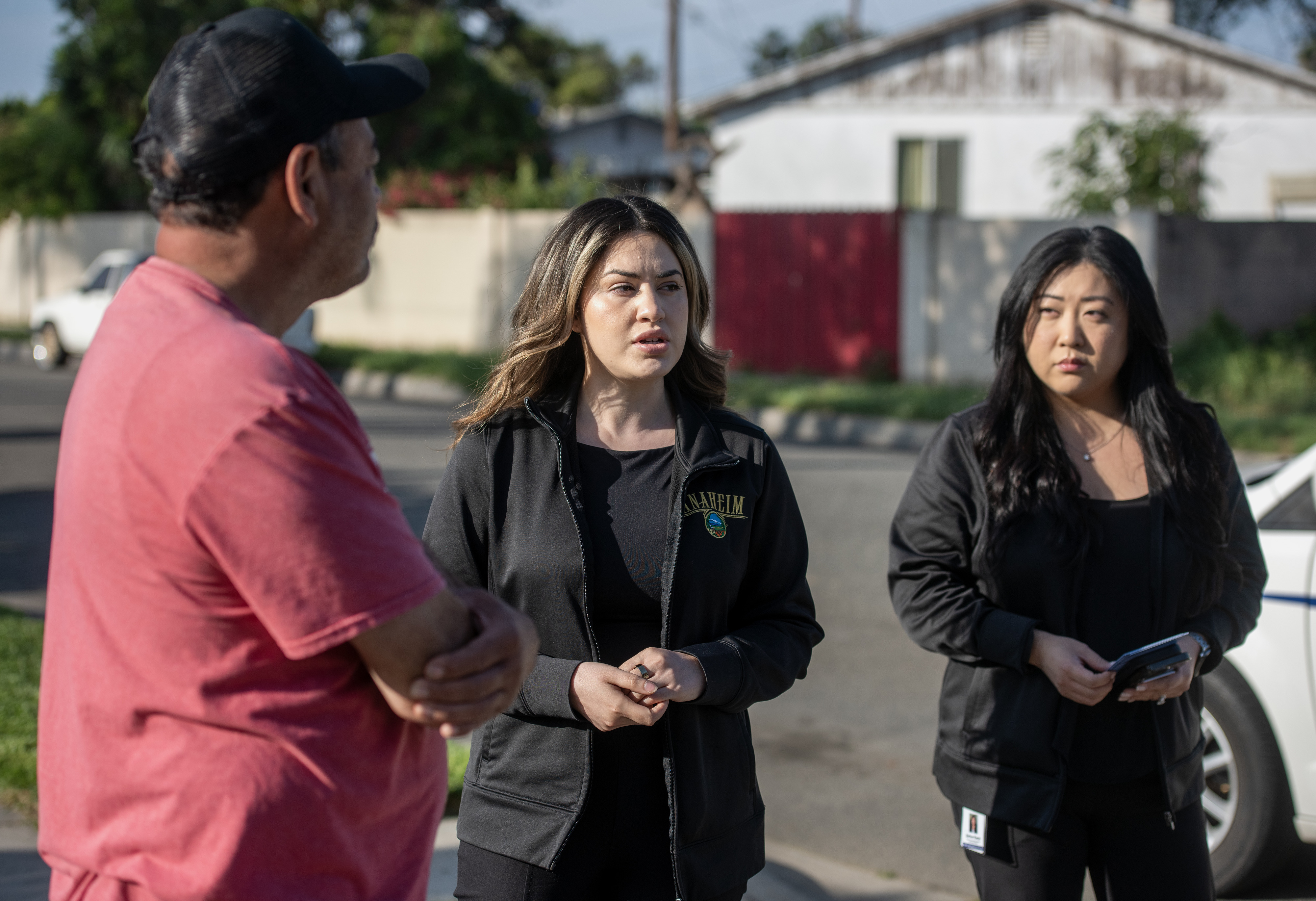 Natalie Aguirre, center, a Communications Specialist for the City of...