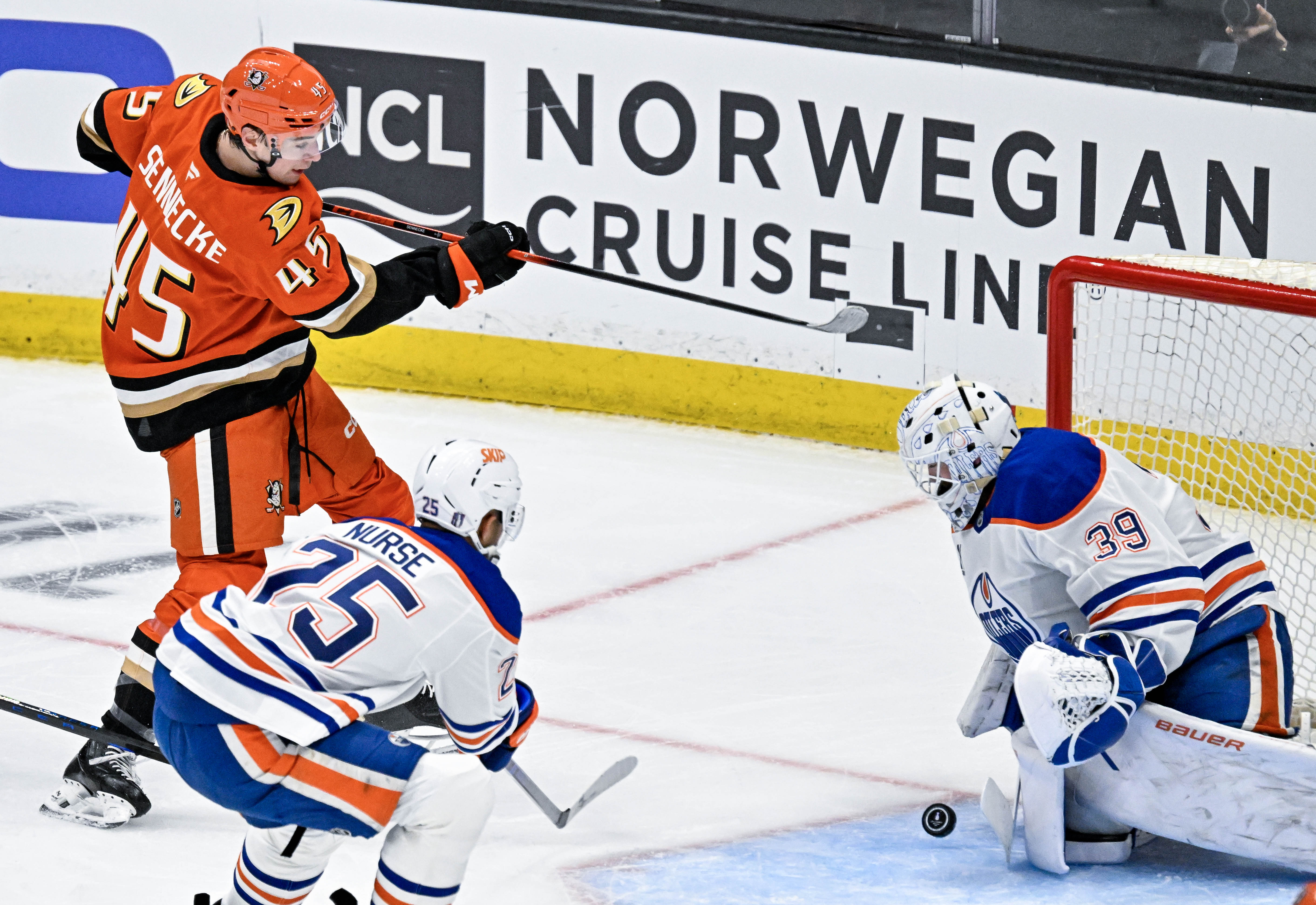The Ducksâ Beckett Sennecke (45) takes a shot on goal...