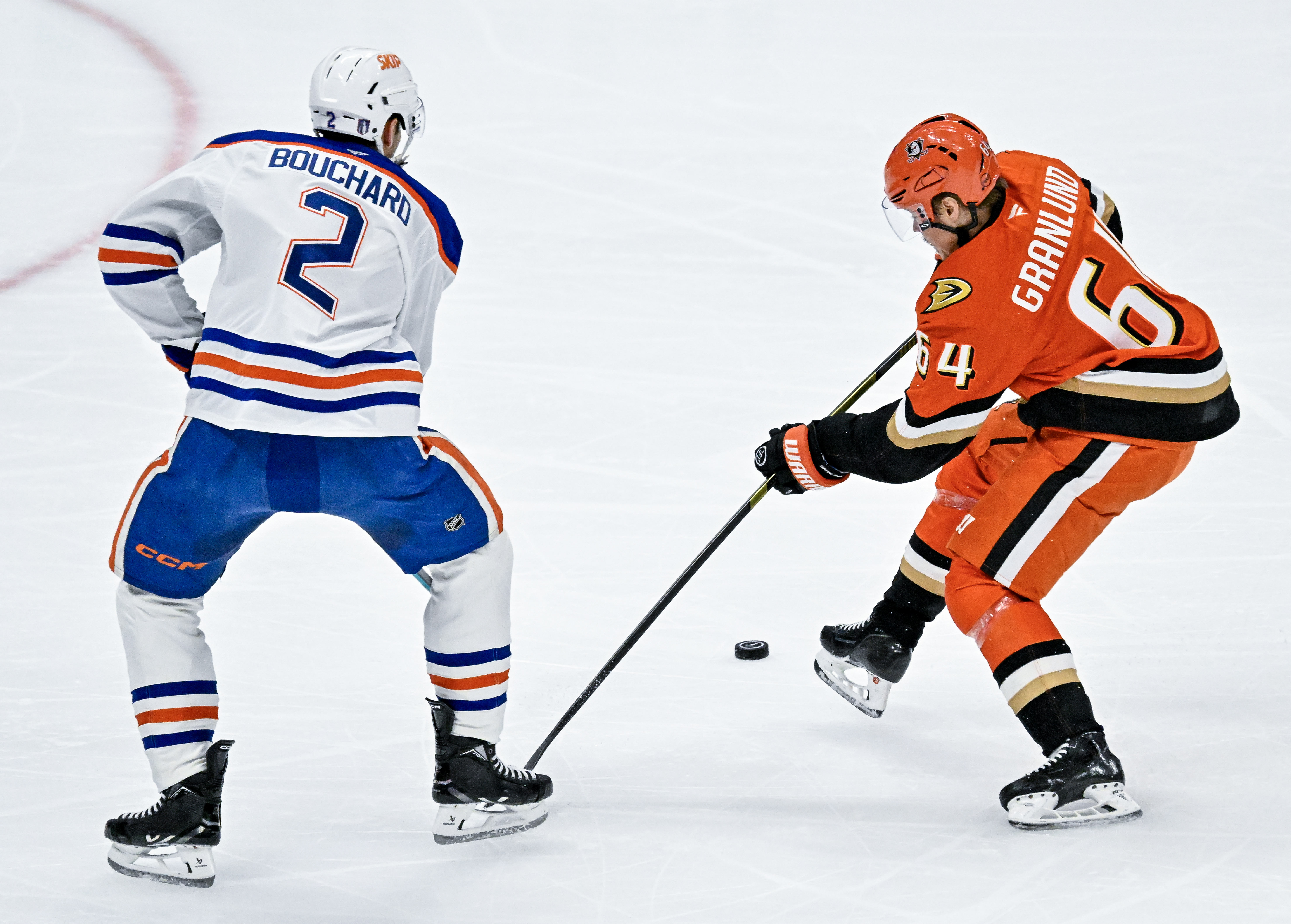 The Ducksâ Mikael Granlund (64) controls the puck during the...