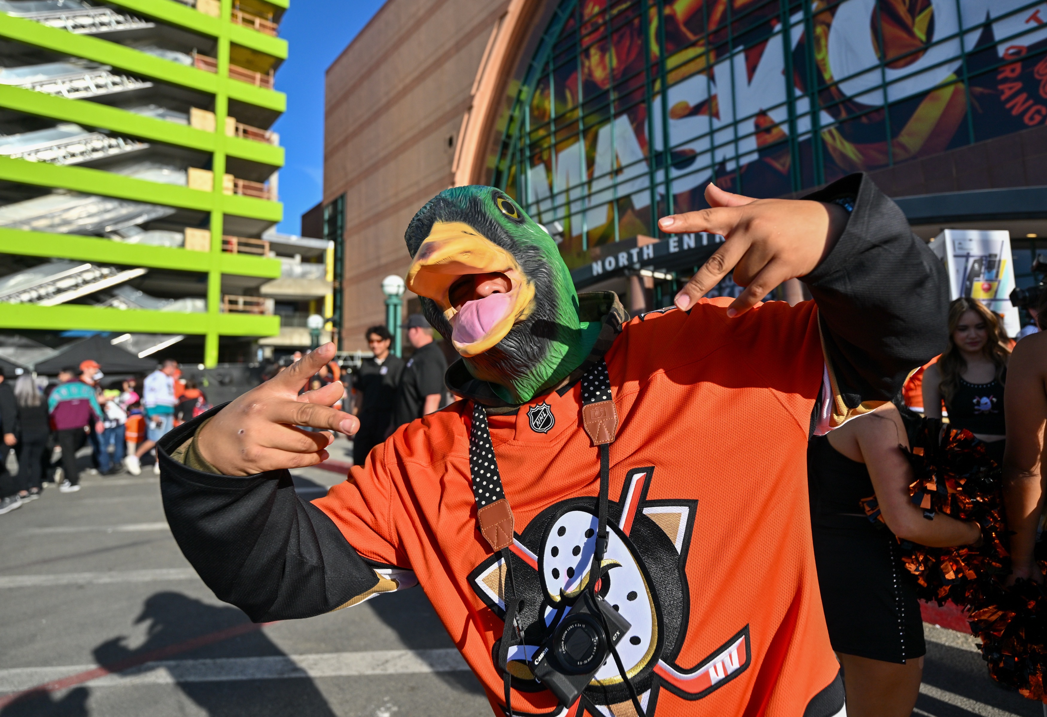 David Zaldivar dons a mallard duck before the Ducks take...
