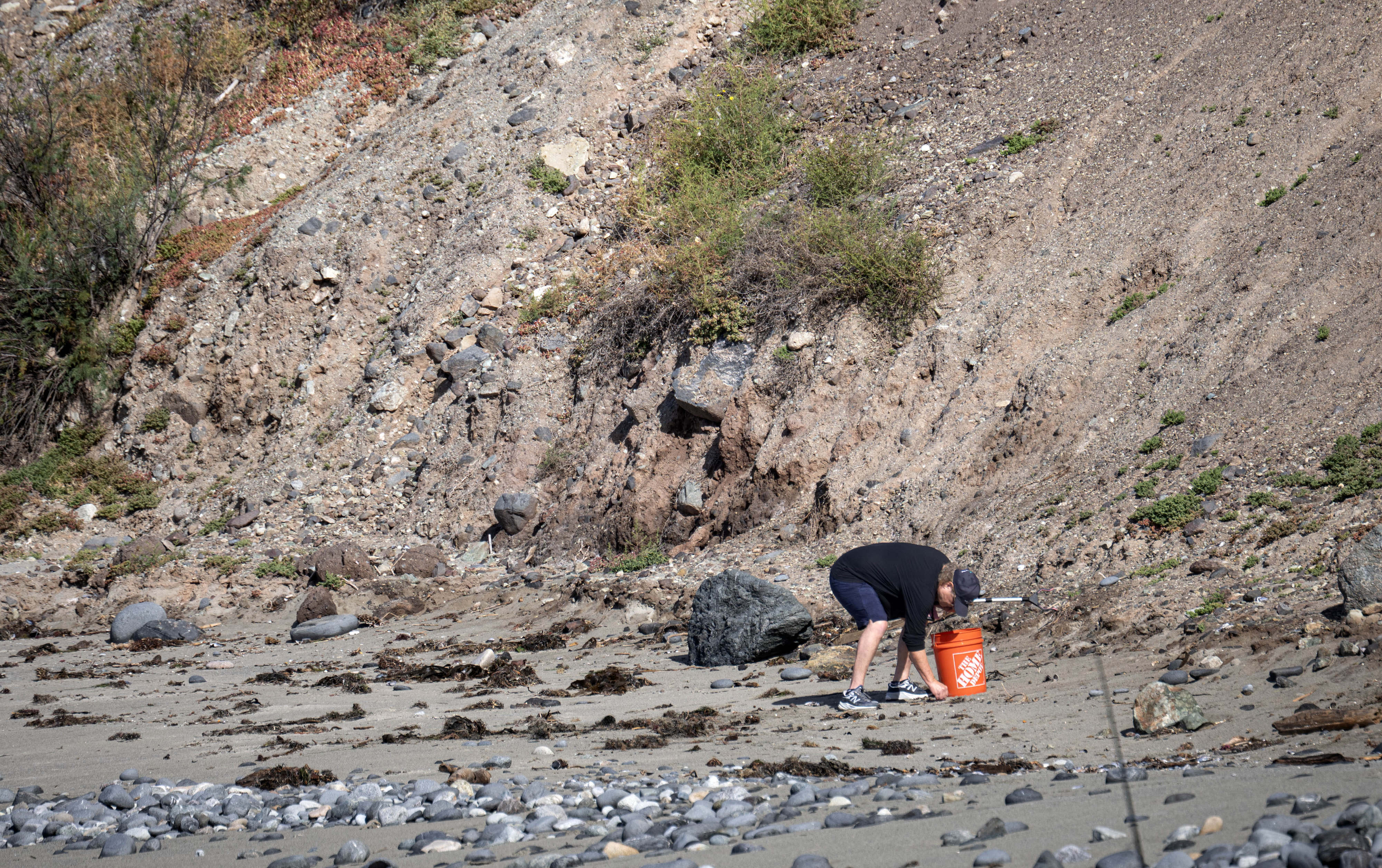 Dozens of people gather trash from Dana Point Harbor on...