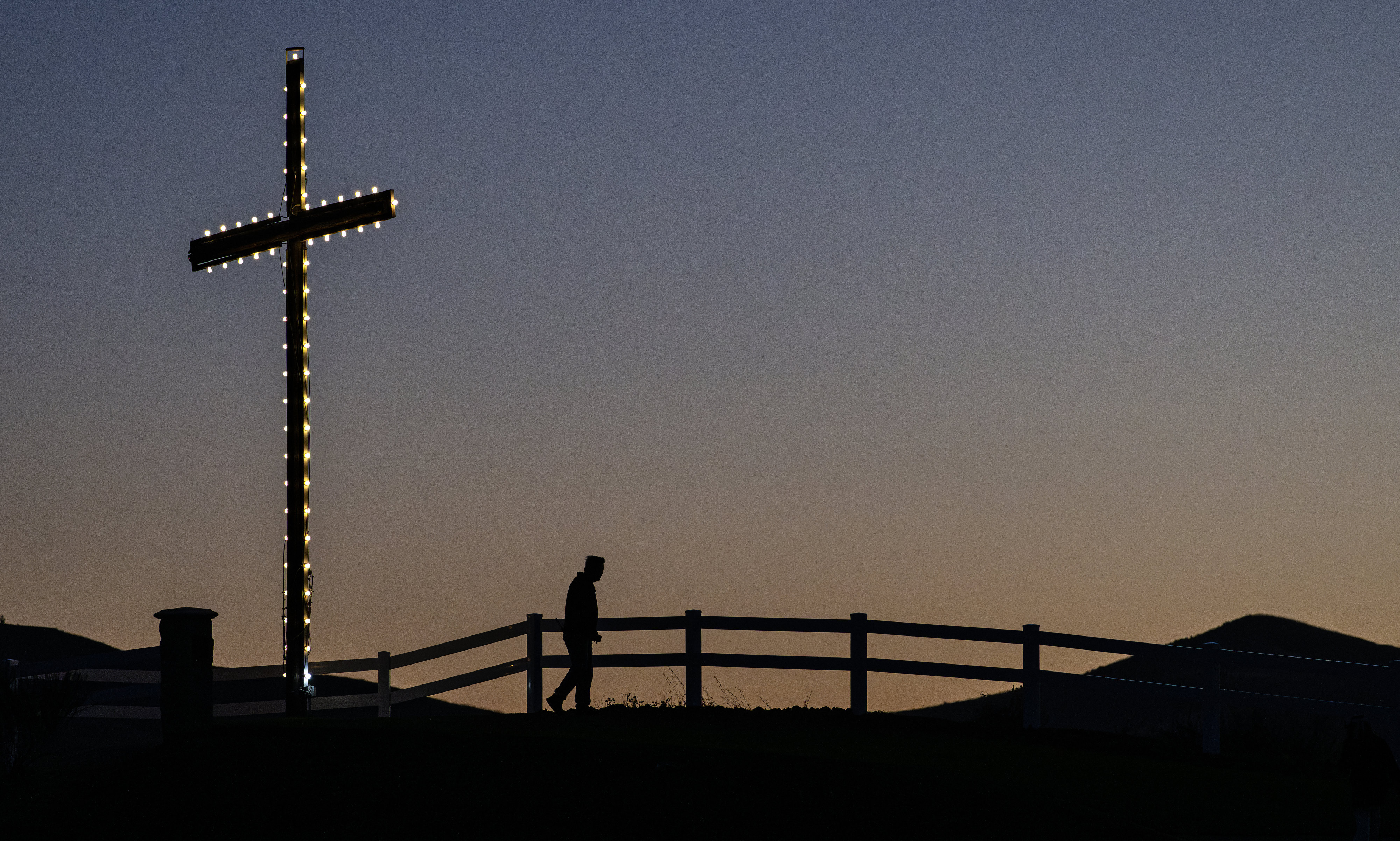 The sun rises over Kindred Churchâs iconic cross during Easter...