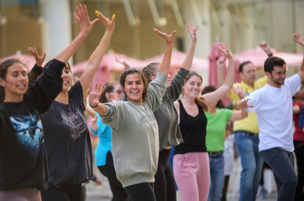 Visitors take part in a free dance class on the Argyros Plaza at the Segerstrom Center for the Arts in Costa Mesa. (Photo by Stan Sholik, Segerstrom Center for the Arts)
