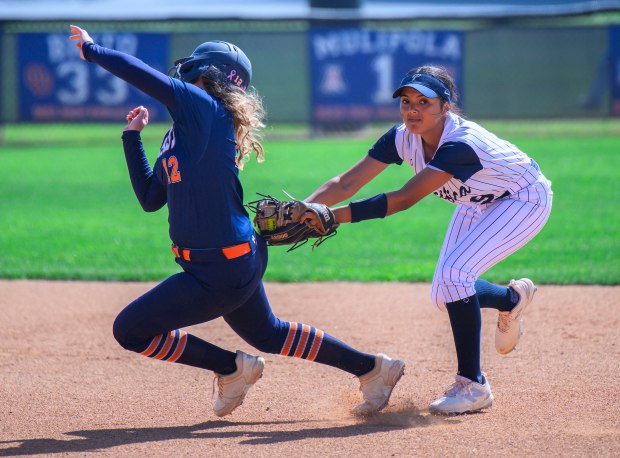 Pacifica second baseman Natalie Pacheco, right, tags out Cypress' Callie Kissell as she tries to advance to second in a Crestview League softball game in Garden Grove on Thursday, March 26, 2026. (Photo by Paul Rodriguez, Contributing Photographer)