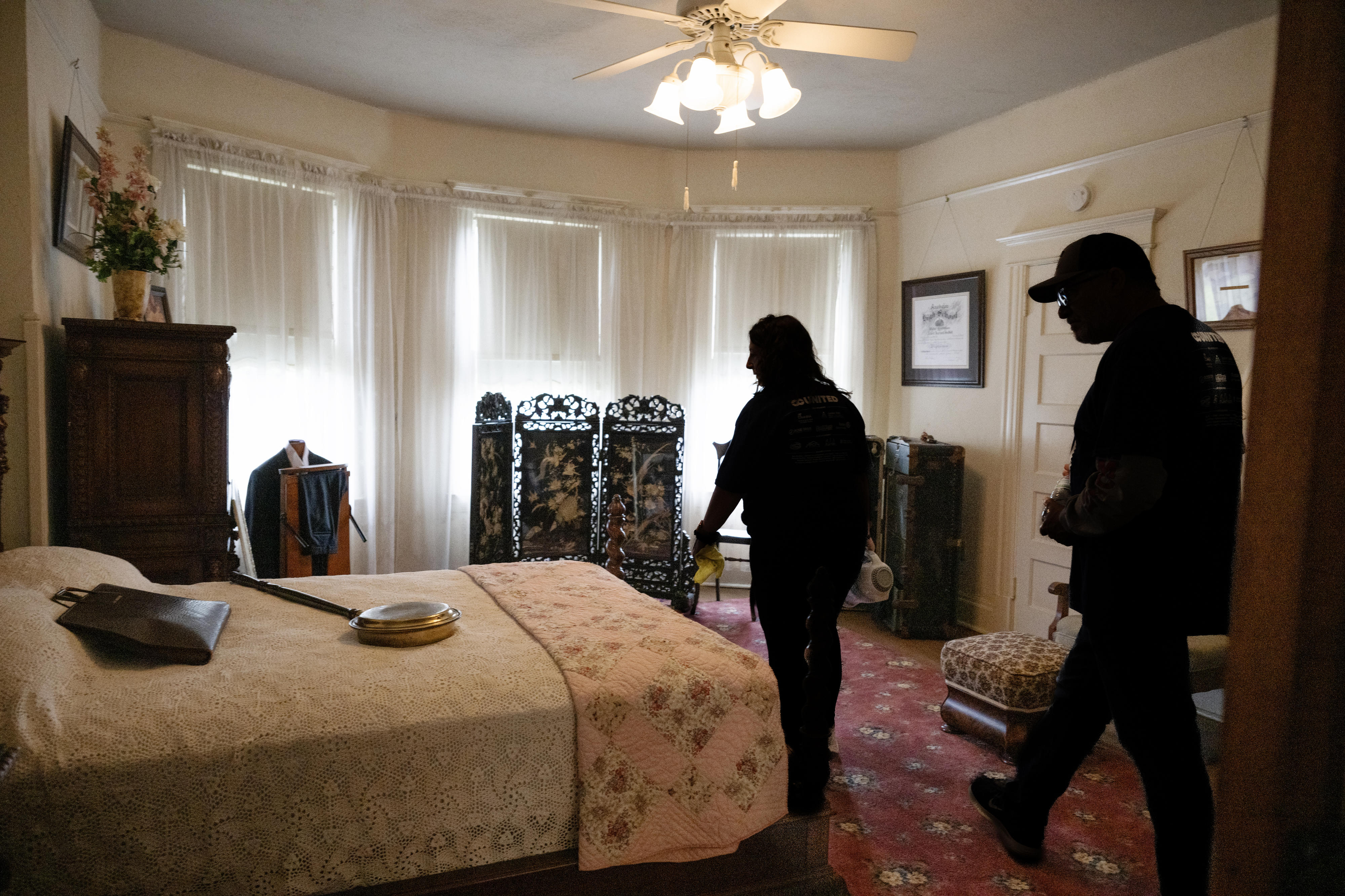 Kris and Scott Daub clean the historic Bradford House master...