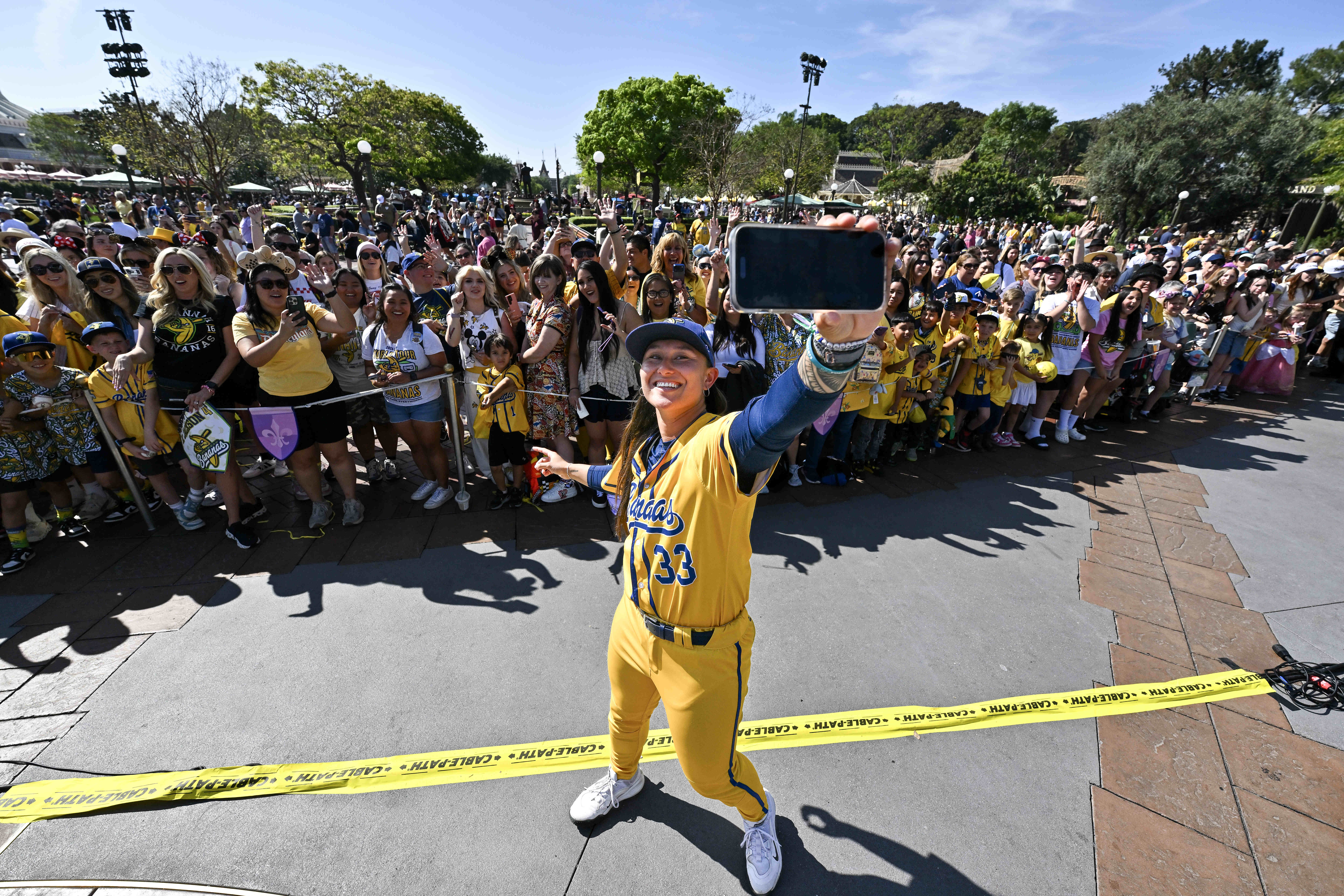 Savannah Bananas pitcher Kelsie Whitmore (33) takes a selfie with...