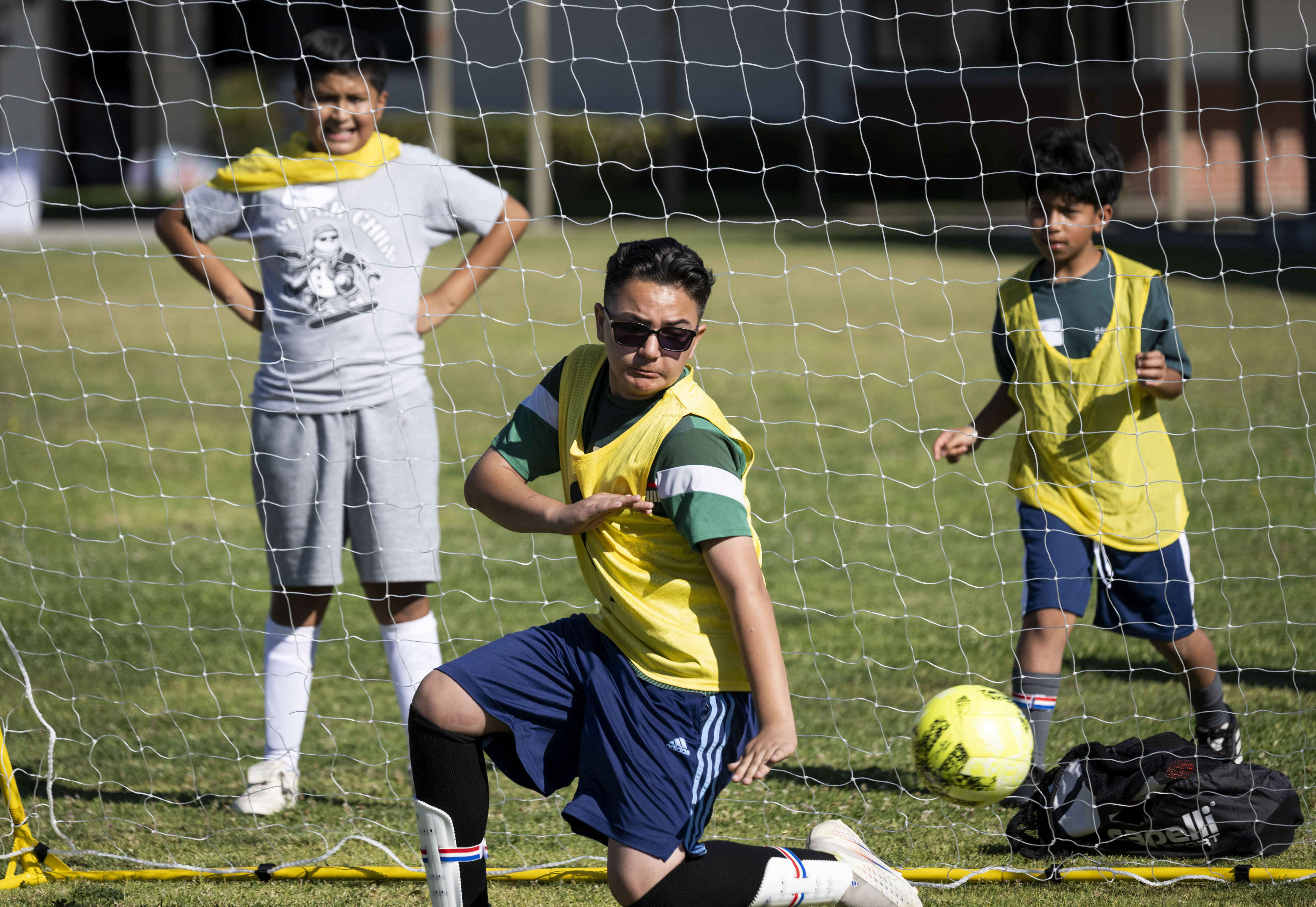 Oscar Romero, from Clinton Elementary School in Garden Grove, tries...