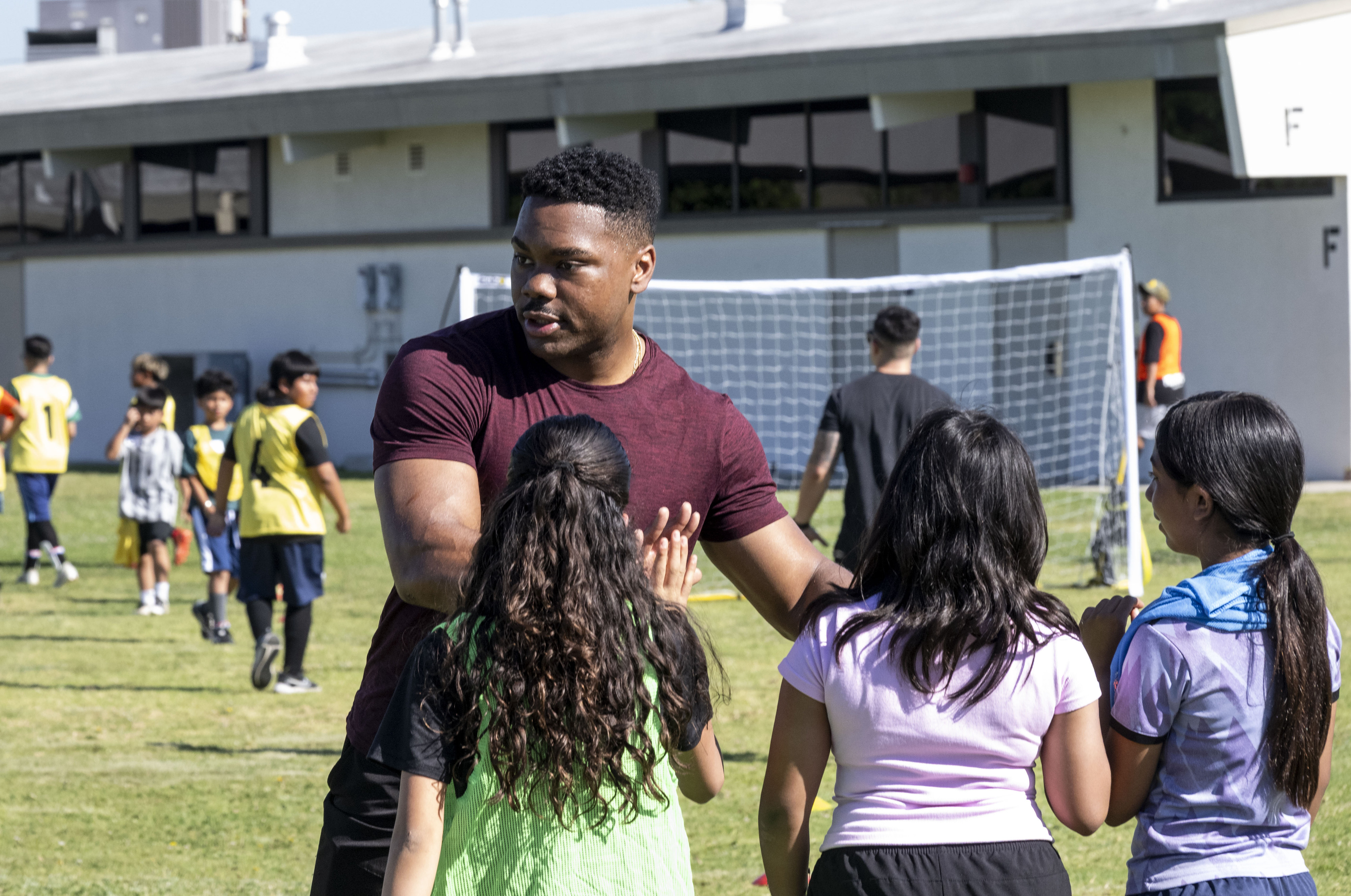 Students get high-fives from Garden Grove Police Department officer Kyle...