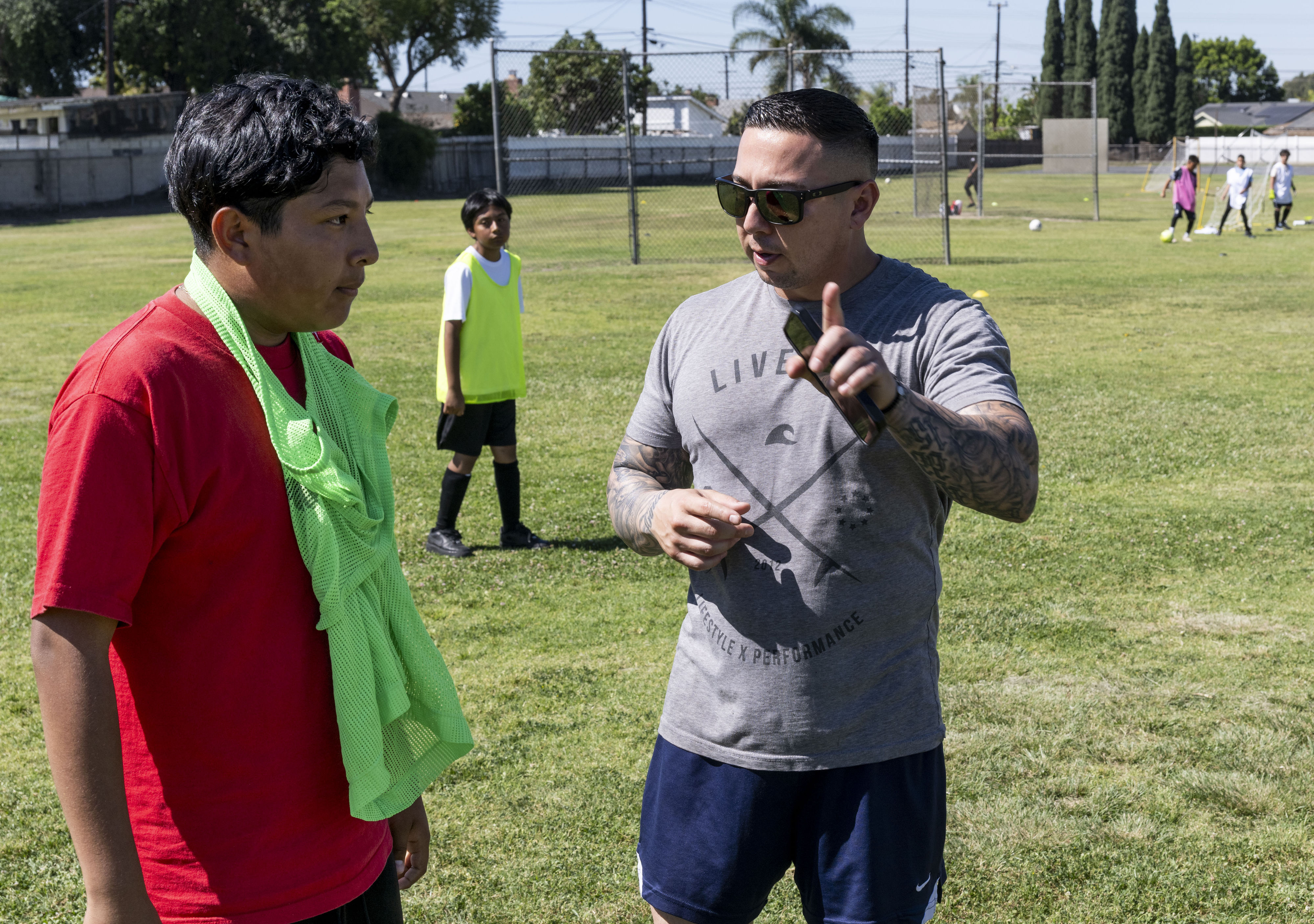 Santa Ana Police Department Cpl. Jonathon Perez gives instruction to...
