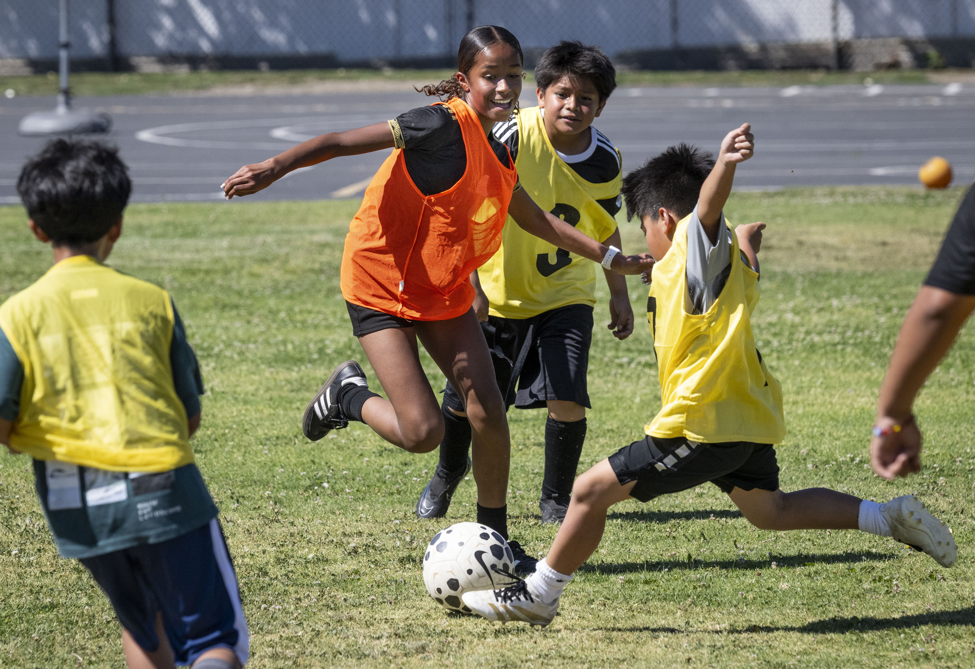 Students play soccer during a OC GRIP (Gang Reduction and...
