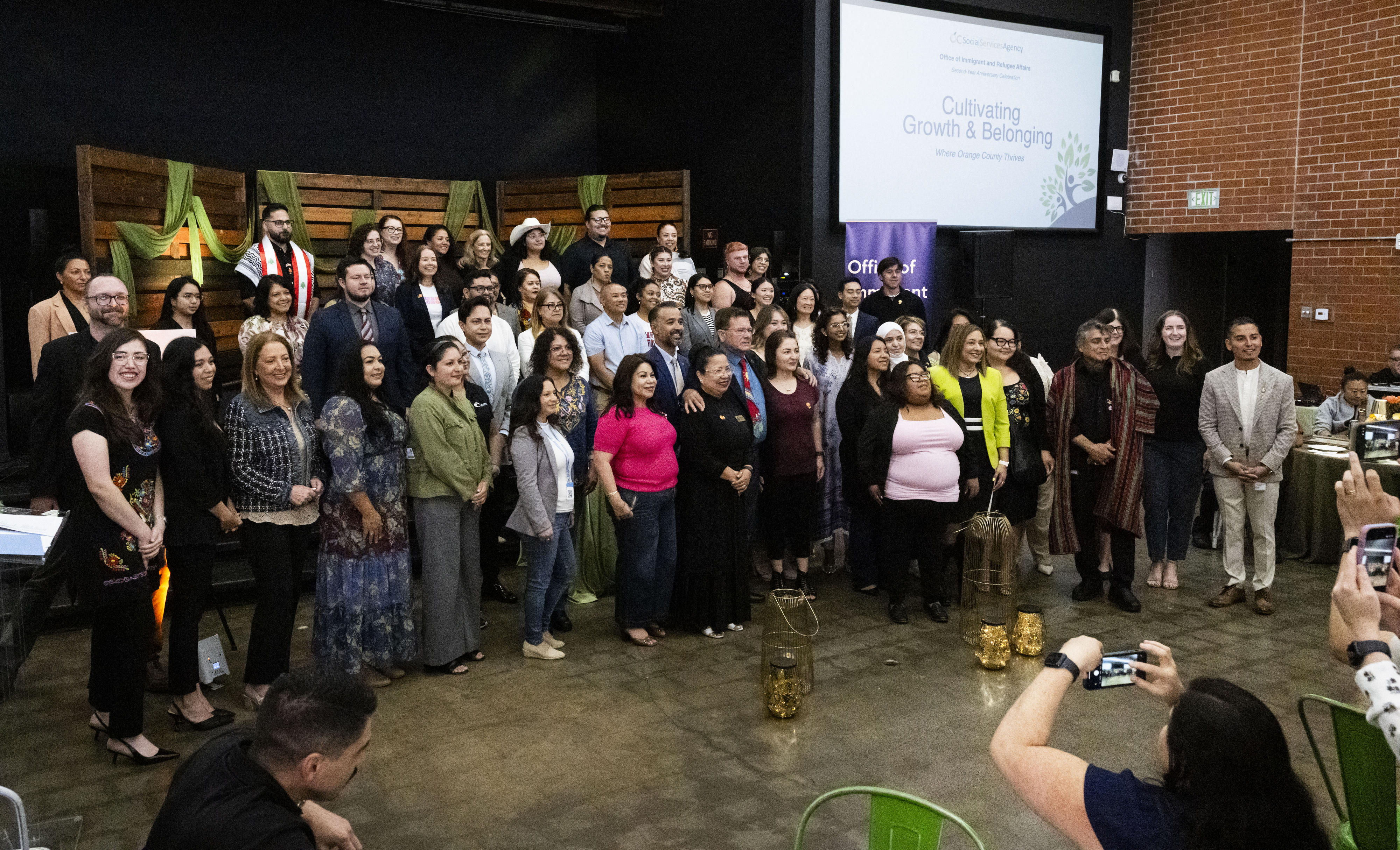 Representatives of local businesses and organizations take a group photo...