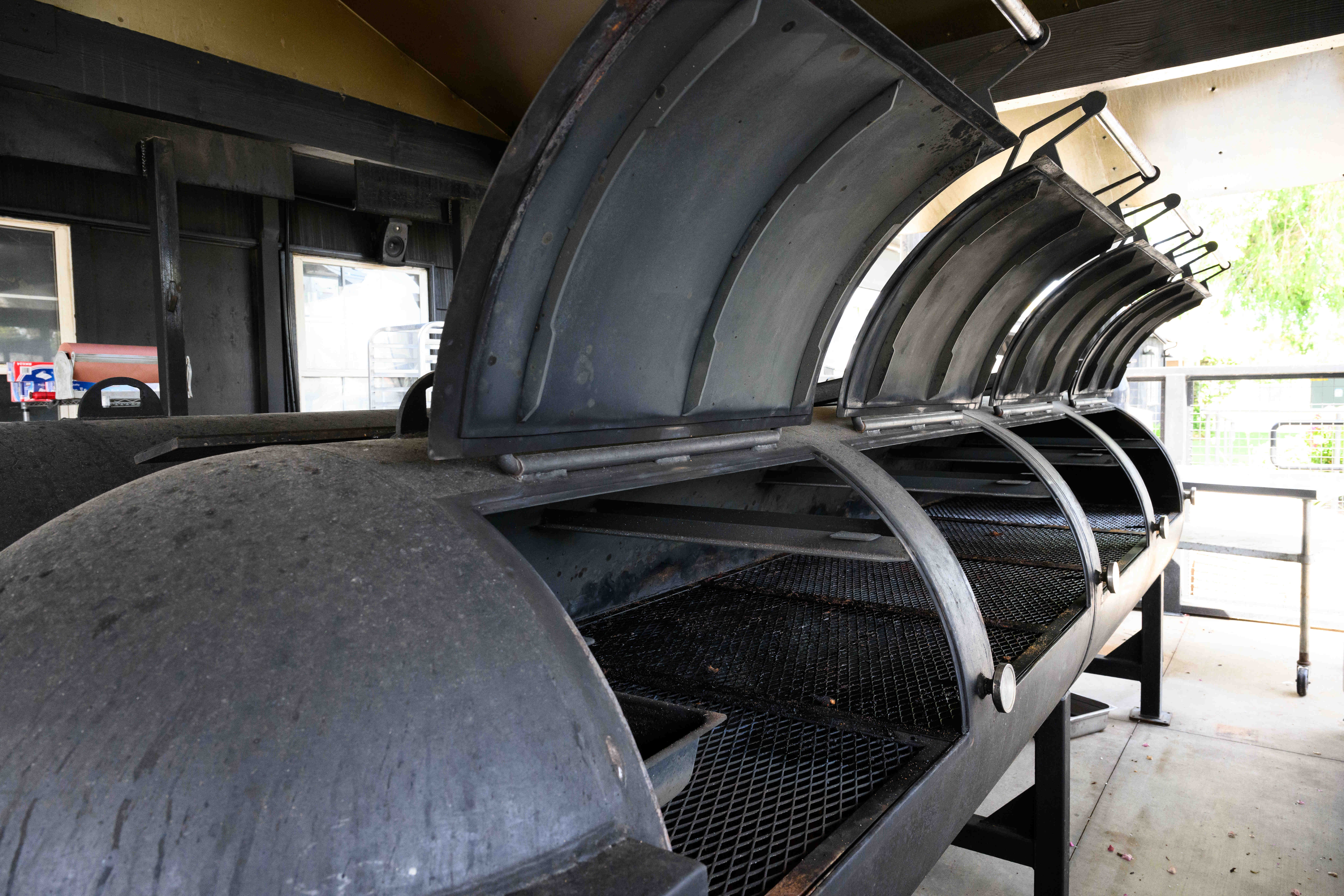 The inside of a smoker at Smoke Queen Barbecue, Thursday,...