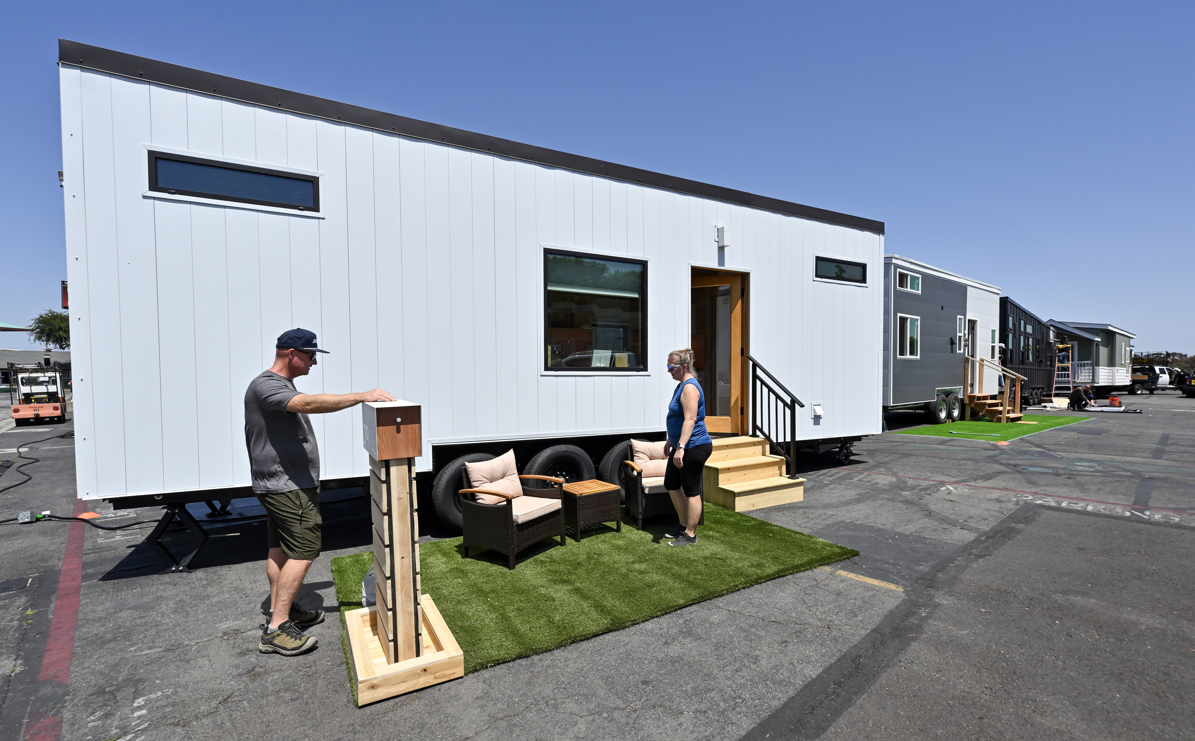Mike Cahill, and his wife, Tasha Cahill, prepare the outside...