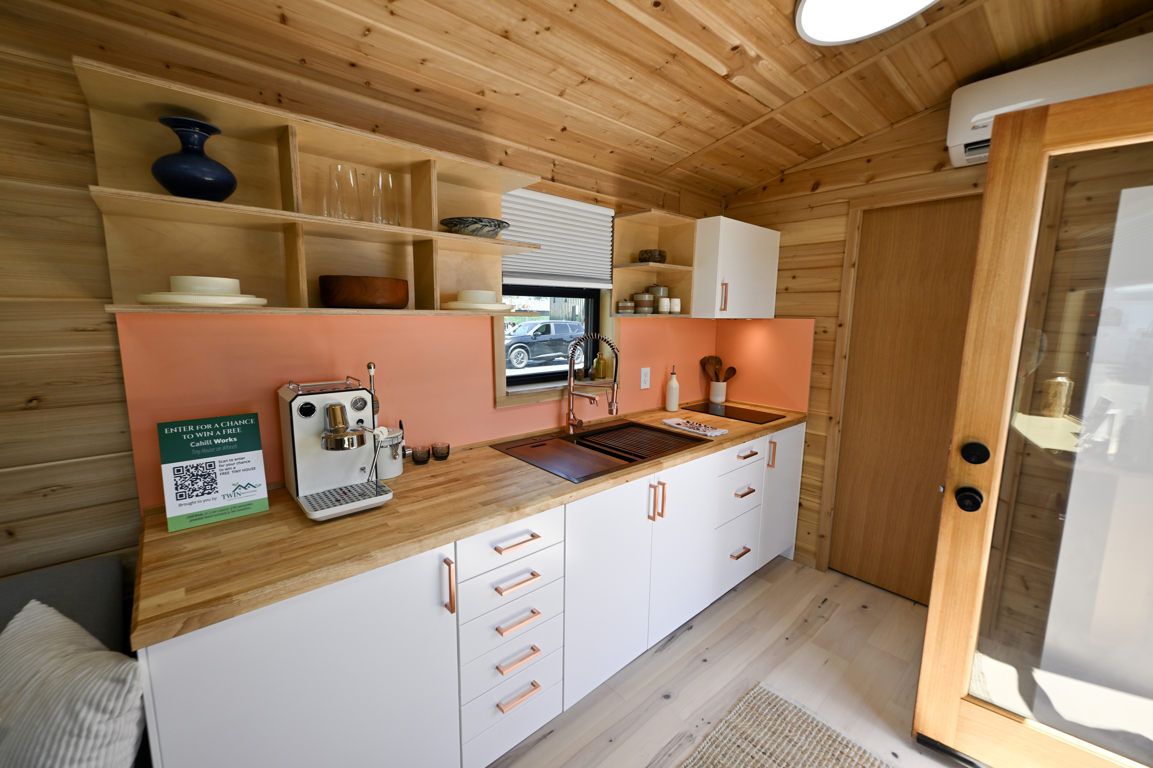 The kitchen area of a Cahill Works tiny home at...