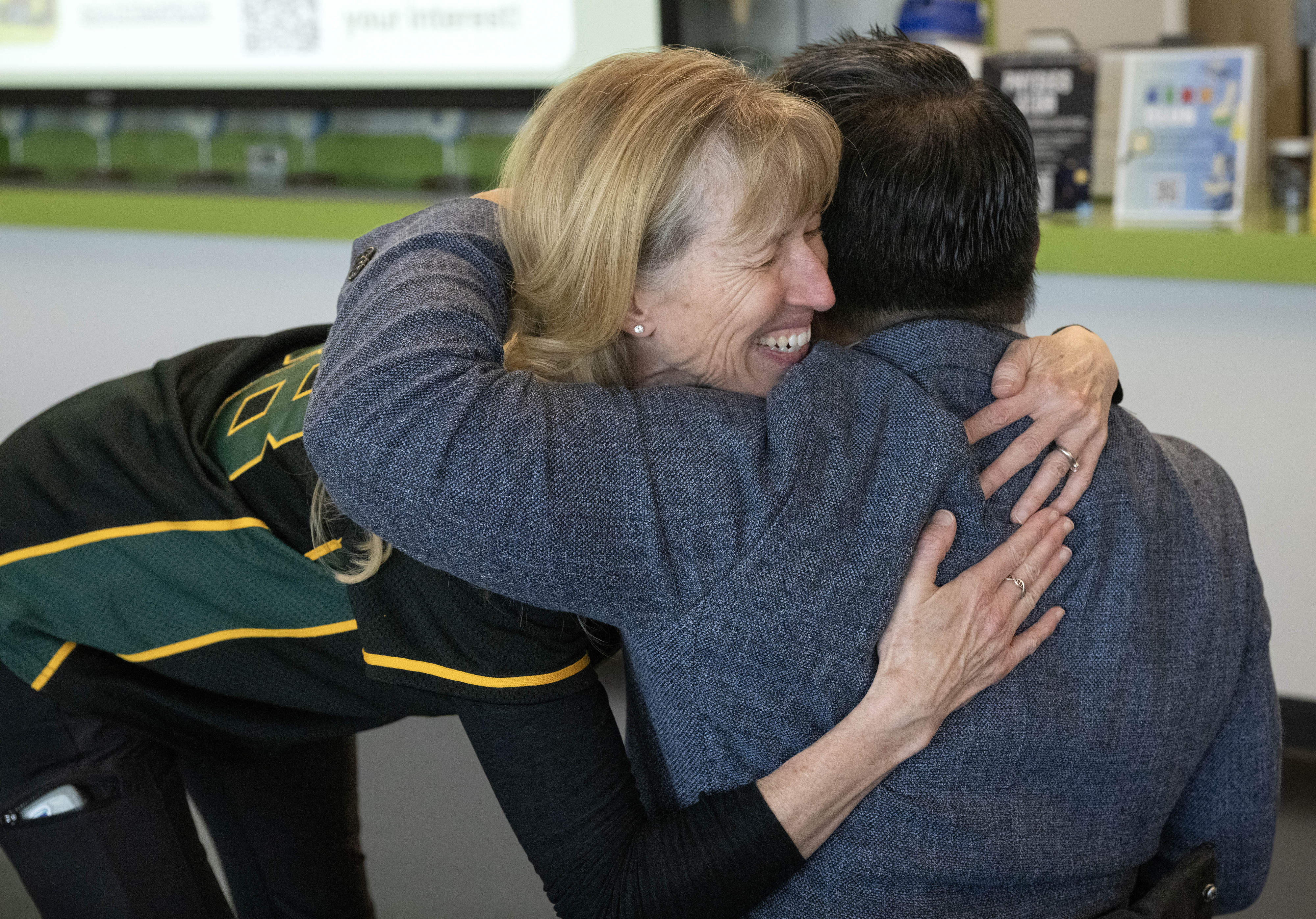 Golden West College chemistry professor, Kate Green, embraces Superintendent Stefan...