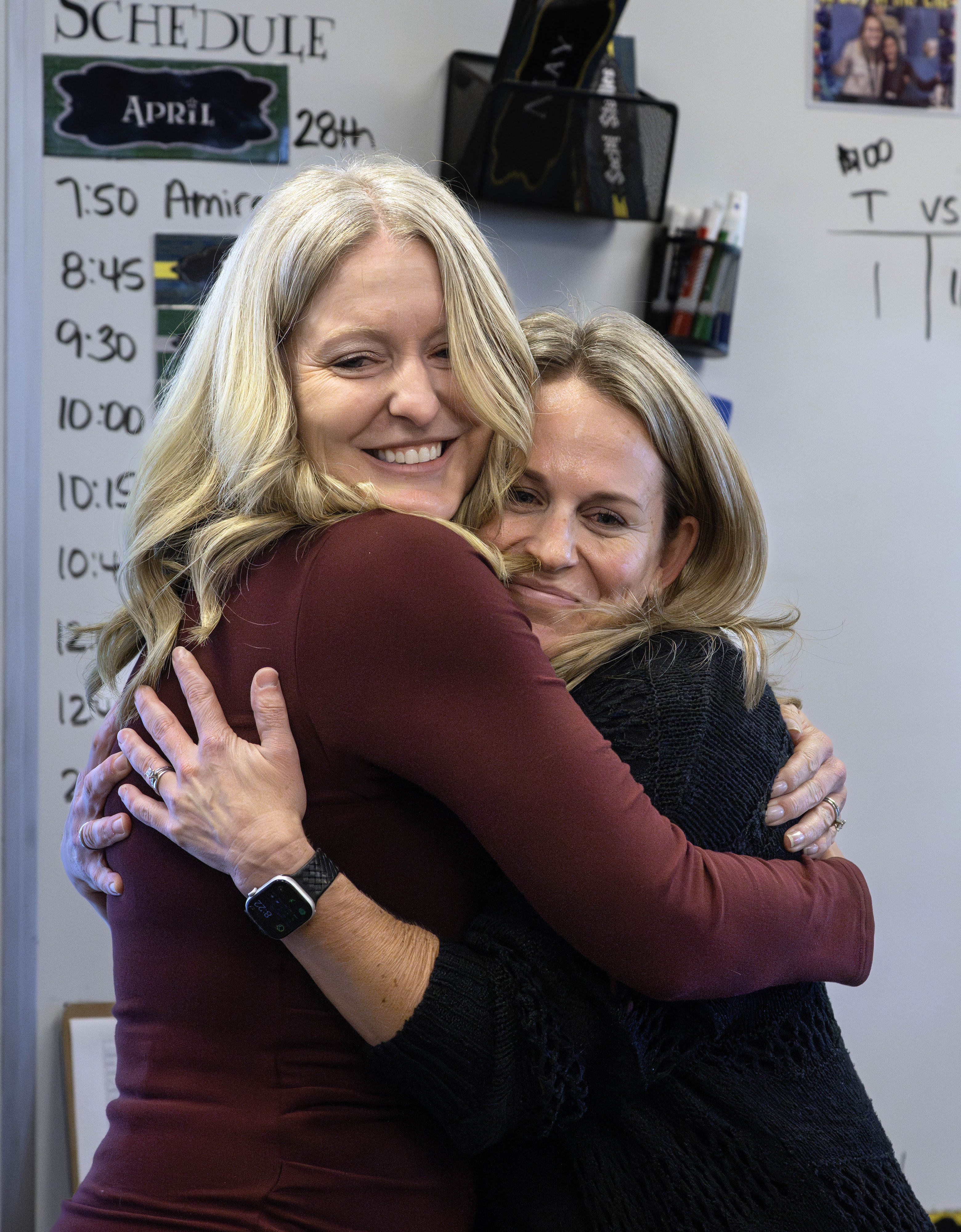 Megan Avalos, right, a fifth-grade teacher at Rossmoor Elementary, gets...