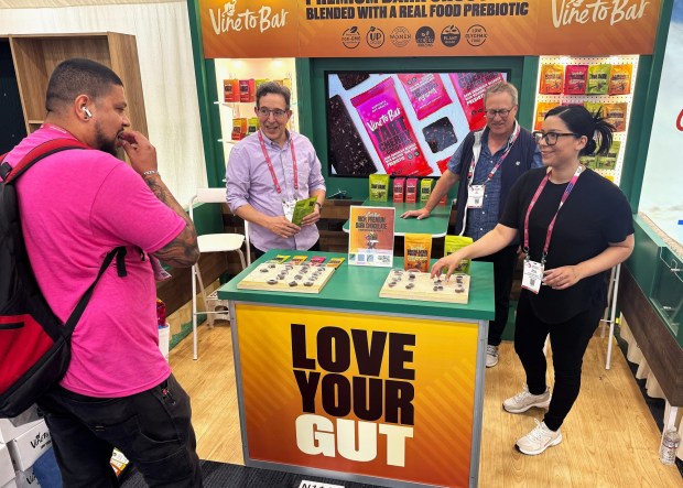 First-time Expo West exhibitor Vine to Bar samples its chocolates blended with a real-food prebiotic made of upcycled chardonnay grapes from Sonoma County. (Photo by David Dickstein)