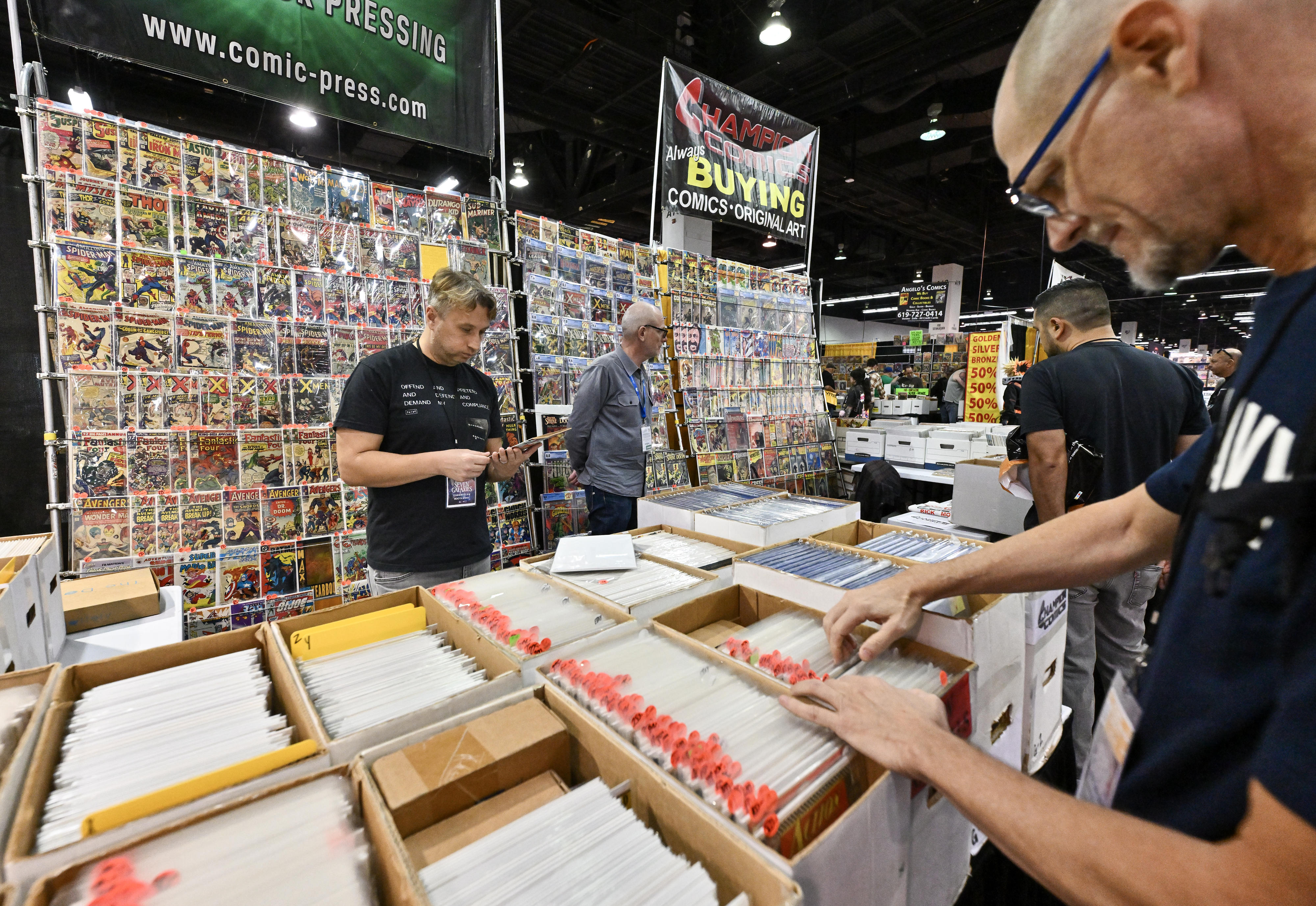 Visitors to WonderCon check out comic books at the Anaheim...
