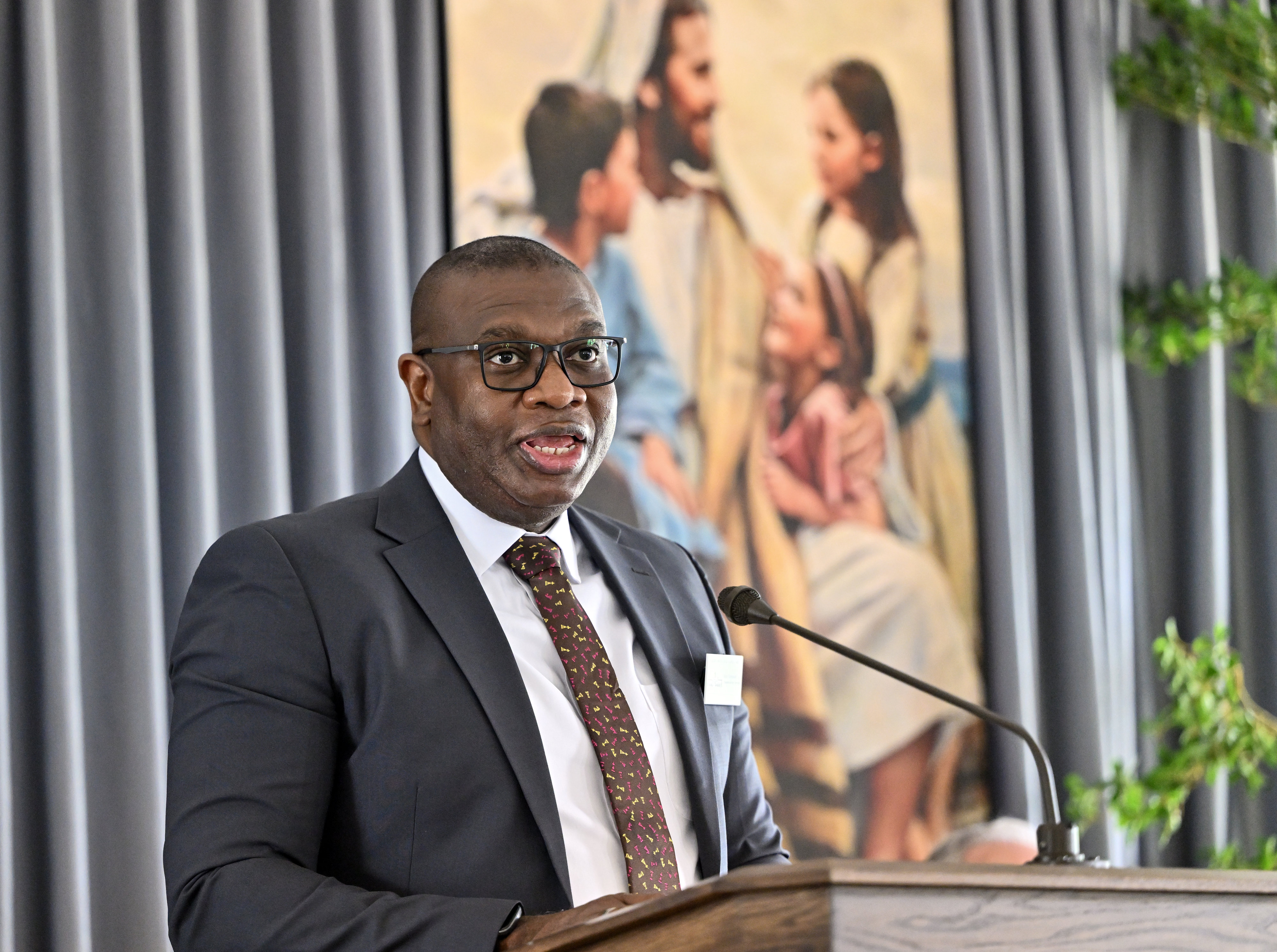 Elder Raymond Egbo speaks during a briefing before the open...