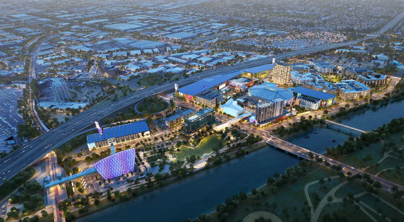 An aerial rendering of the OCVIBE district at night.