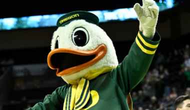 Michigan head coach Dusty May swings the net after winning the NCAA national championship against Connecticut at Lucas Oil Stadium in Indianapolis on Monday, April 6, 2026.