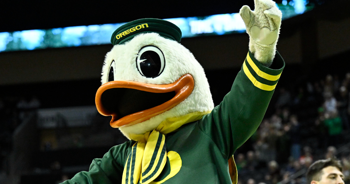 Michigan head coach Dusty May swings the net after winning the NCAA national championship against Connecticut at Lucas Oil Stadium in Indianapolis on Monday, April 6, 2026.