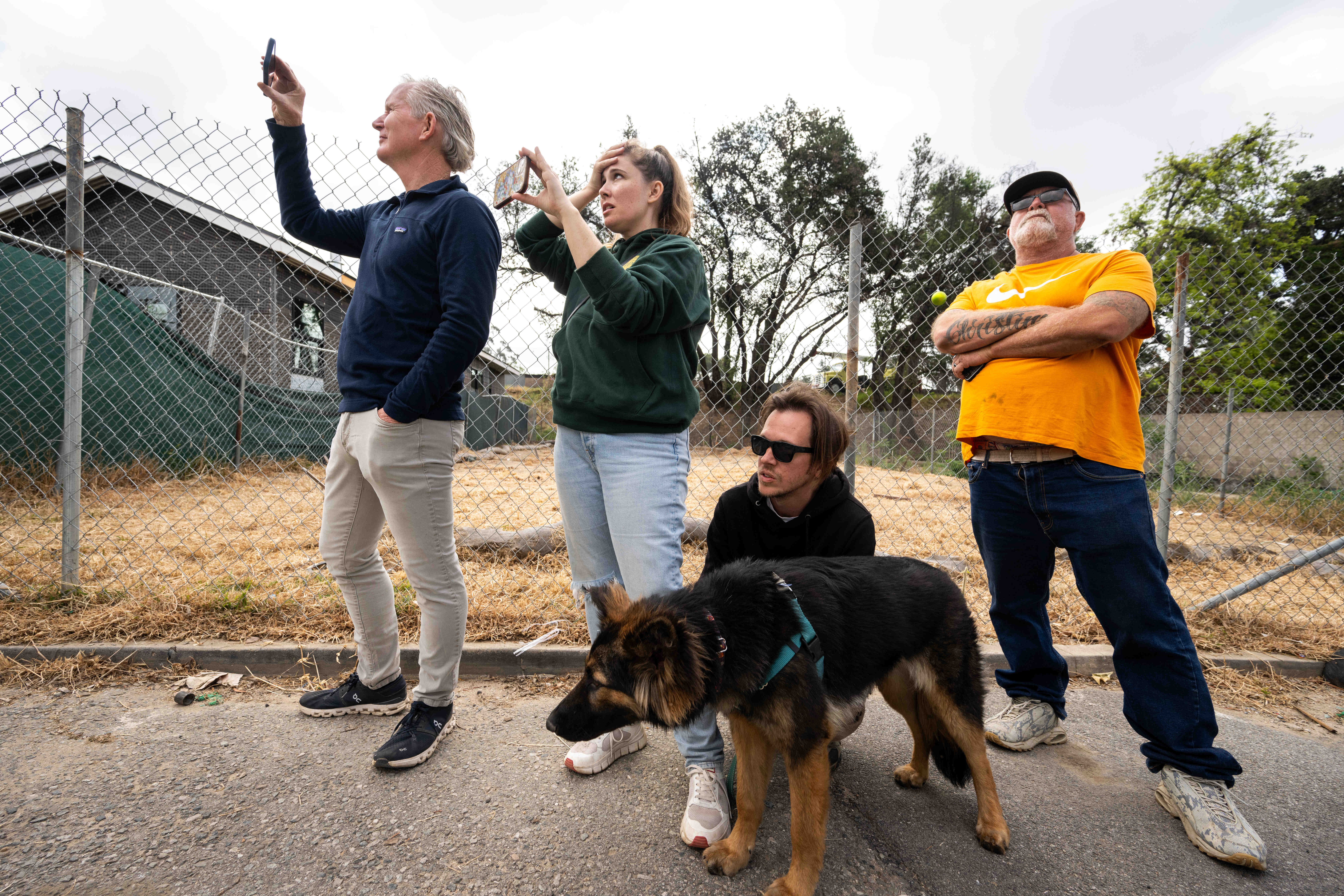 Brooke Lohman-Janz, center, and her husband Michael Janz, with their...