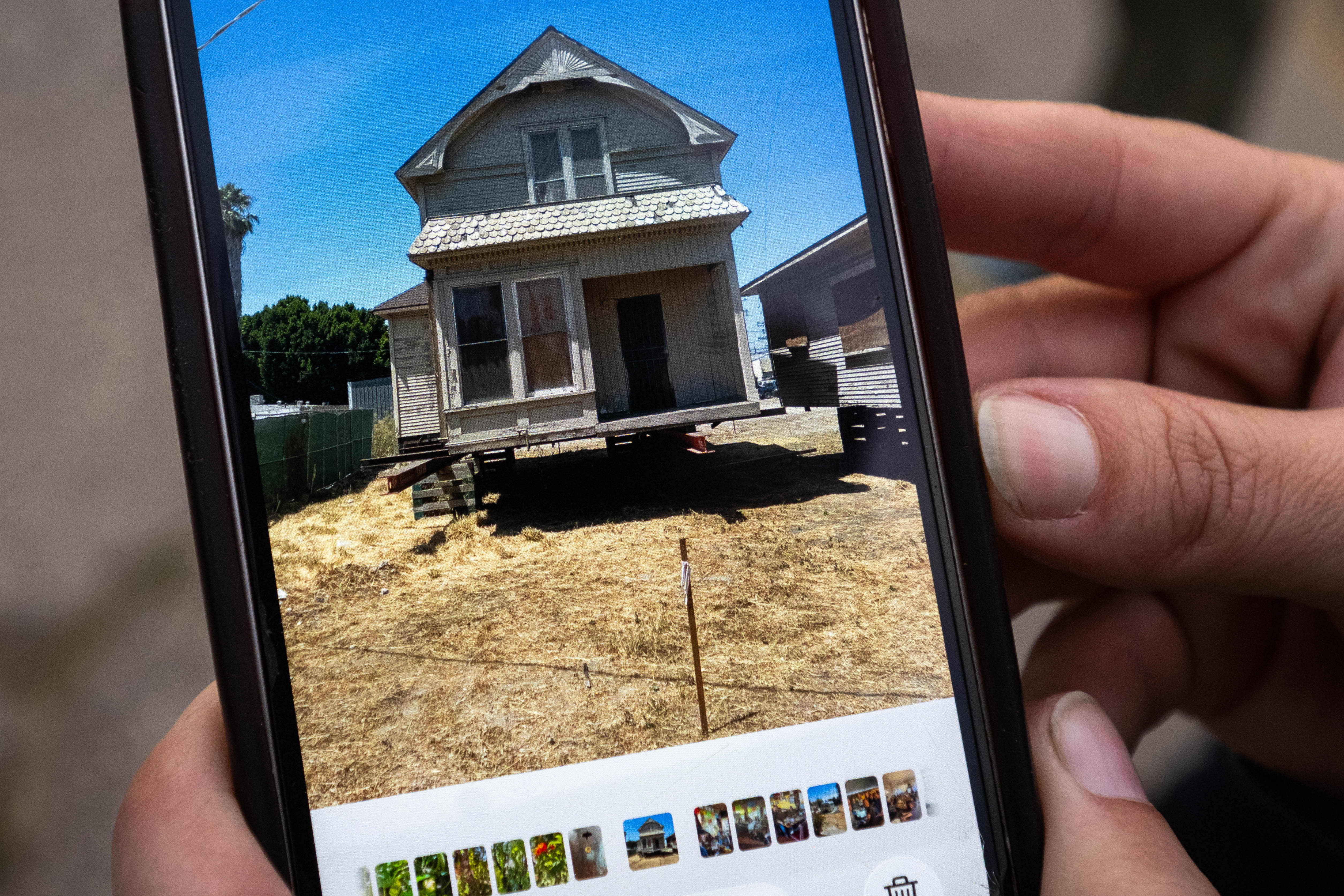 Brooke Lohman-Janz shows a photo of the 1895 Victorian-era home...
