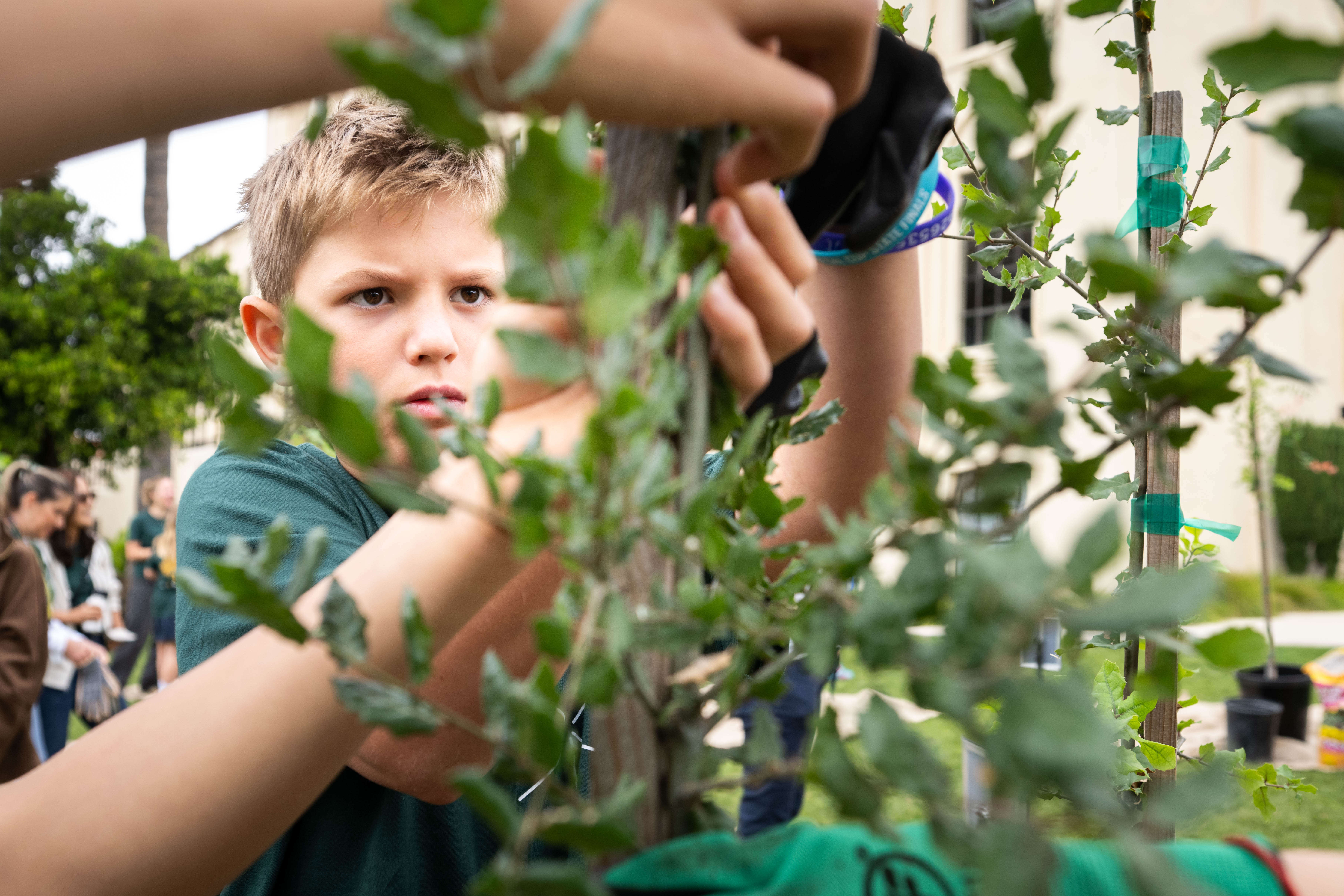 Sebastian Mahnovski, 11, of Saint Markâs School, tapes up a...