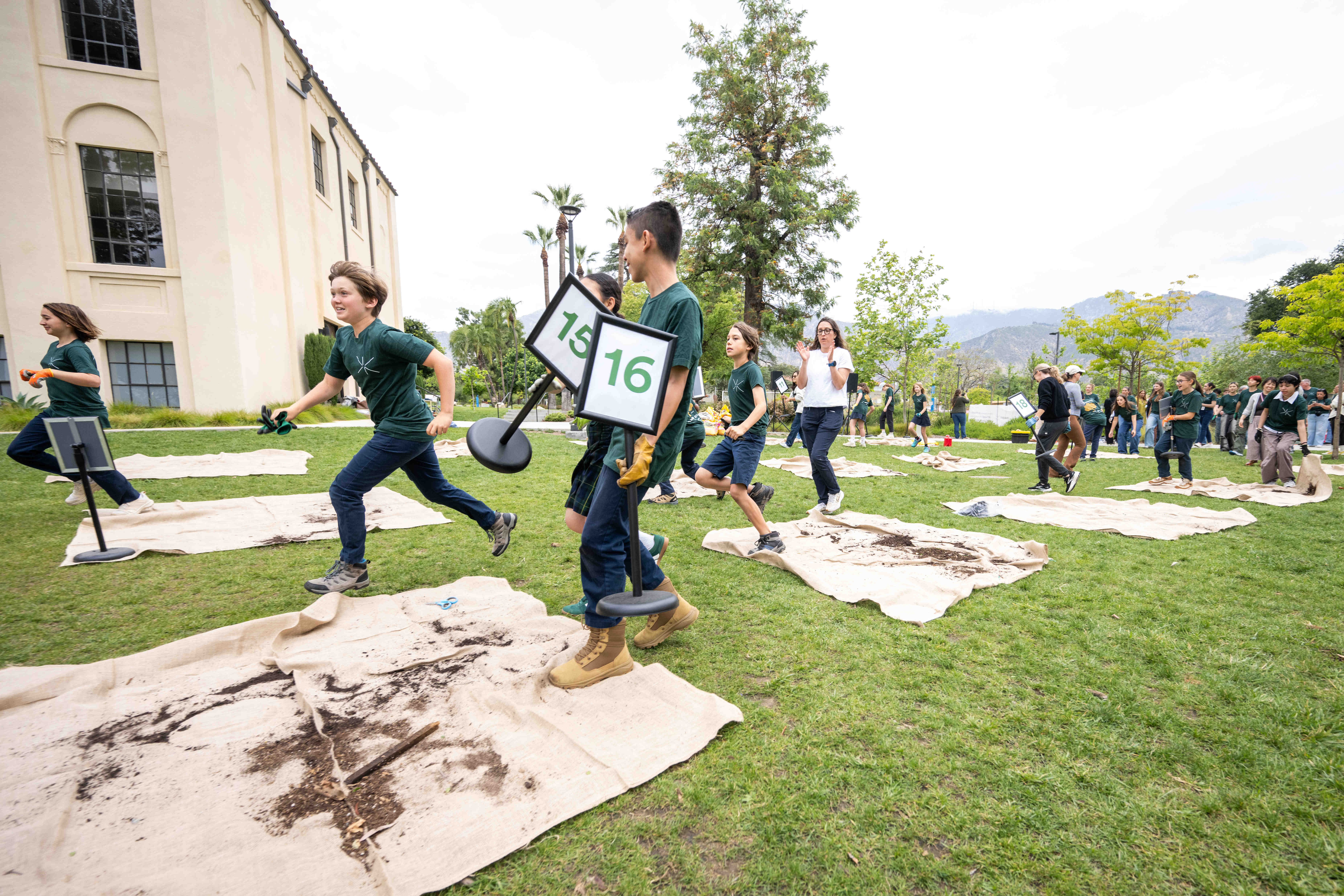 Saint Markâs and EF Academy students clean up after repotting...