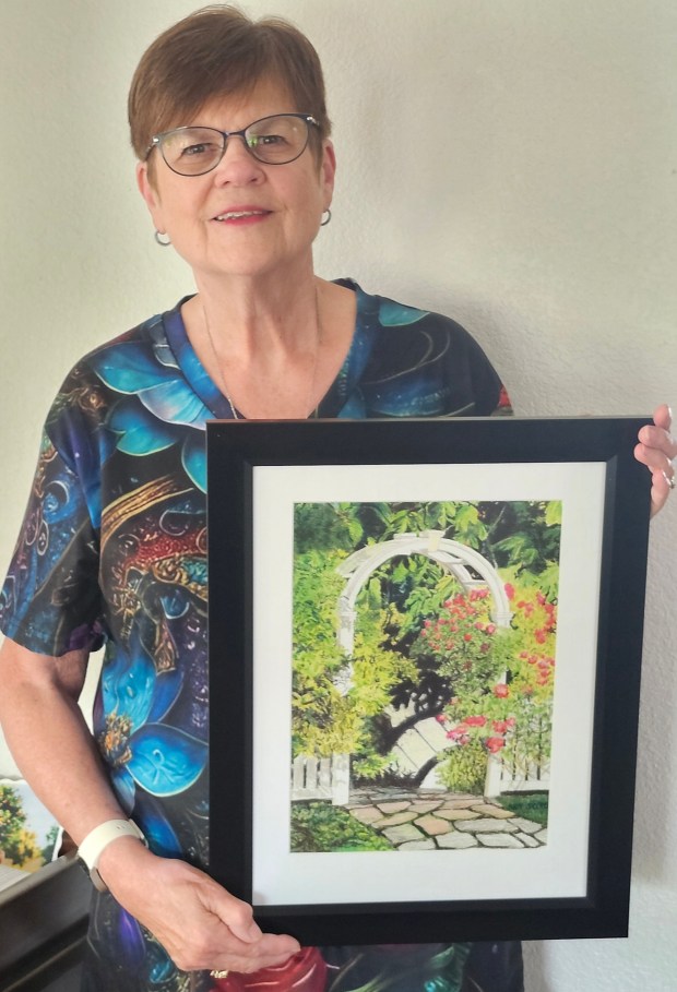 Judy Jacobs, president of the Colored Pencil Society of America, San Diego District Chapter 202, with one of her framed colored pencil pieces. (Courtesy of Judy Jacobs)