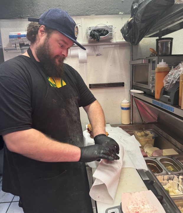 Chef James "Big Jim" Jones, having some fun while making one of his popular sandwiches. (Courtesy of James Jones)