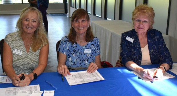 Theresa Martin, Debbie Schneider and Bridget Denihan at the registration table. (Elizabeth Marie Himchak)