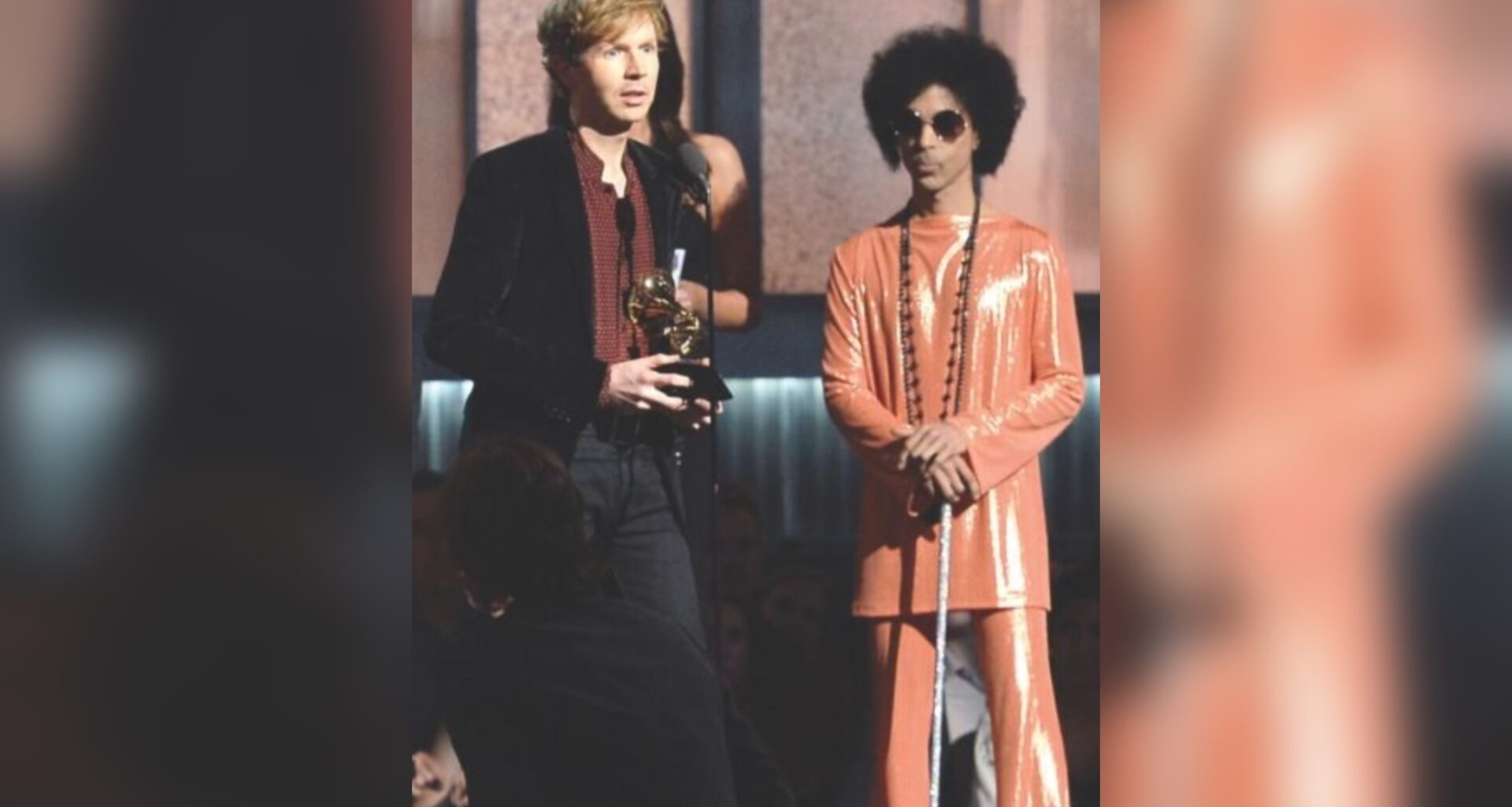 LOS ANGELES, CA - FEBRUARY 08: Musician Beck (L) accepts Album of the Year for