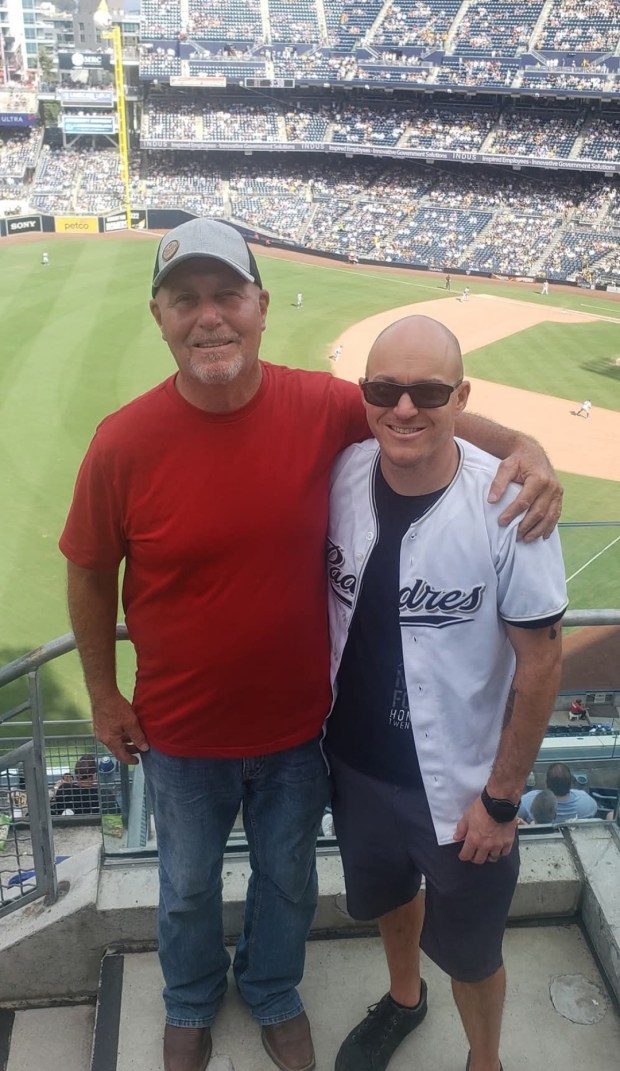 Craig Fischer poses with his son Dakota Fischer at a San Diego Padres baseball game. Baseball was a shared passion between the two. (Courtesy Dakota Fischer)