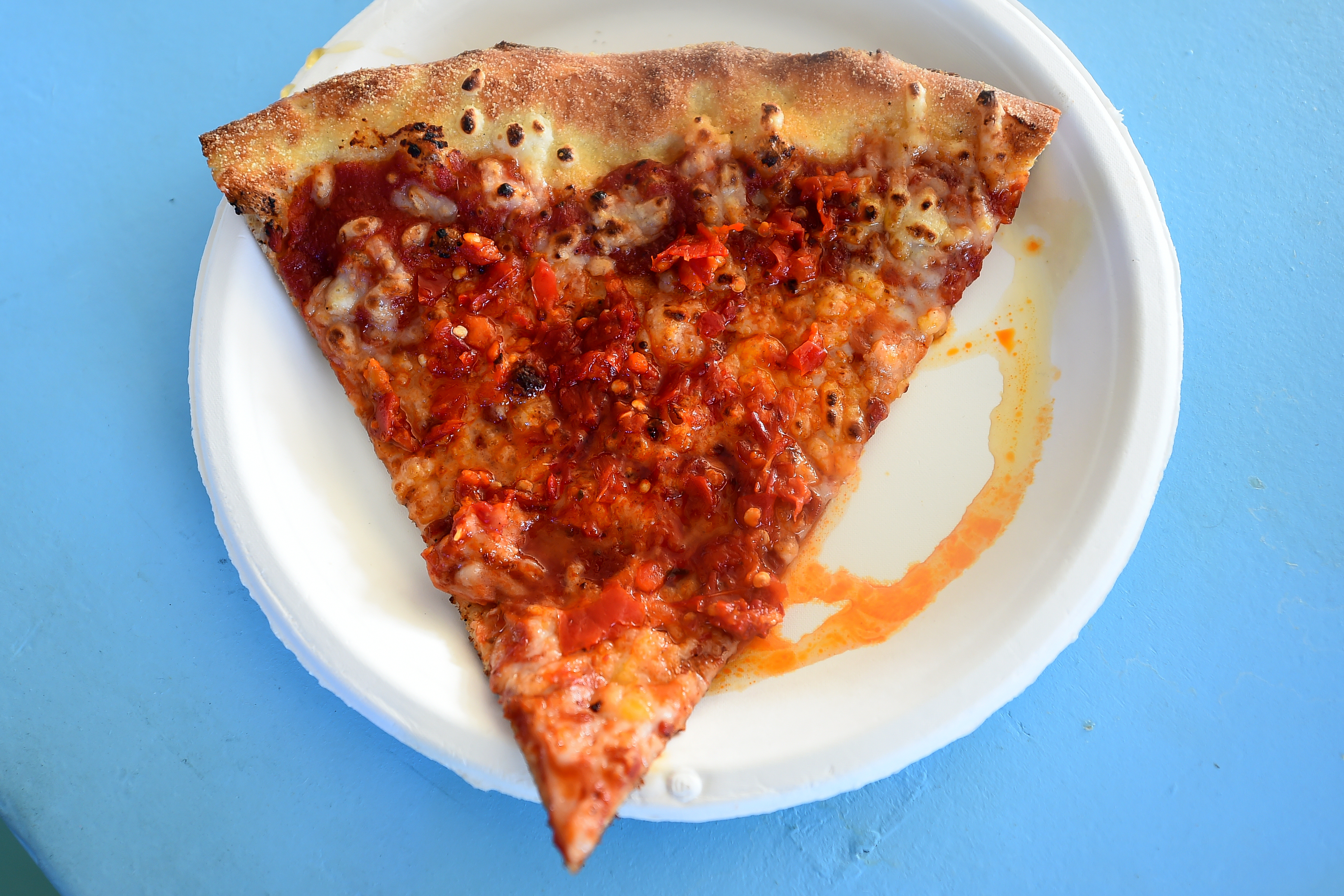 A Killa Beez slice of pizza is served at Forever...