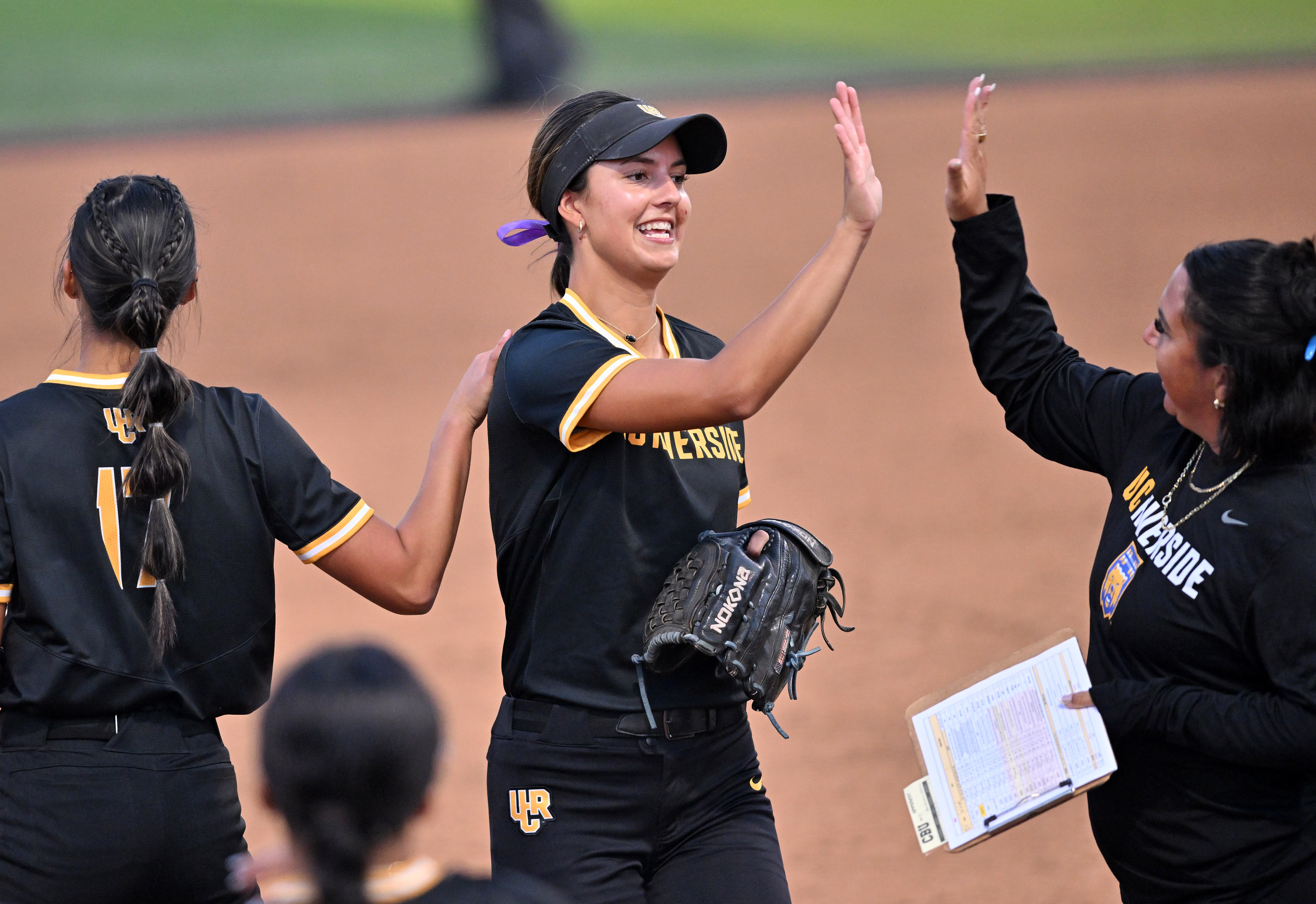 UC Riverside’s Eta Lauti is congratulated by head coach Brittney...