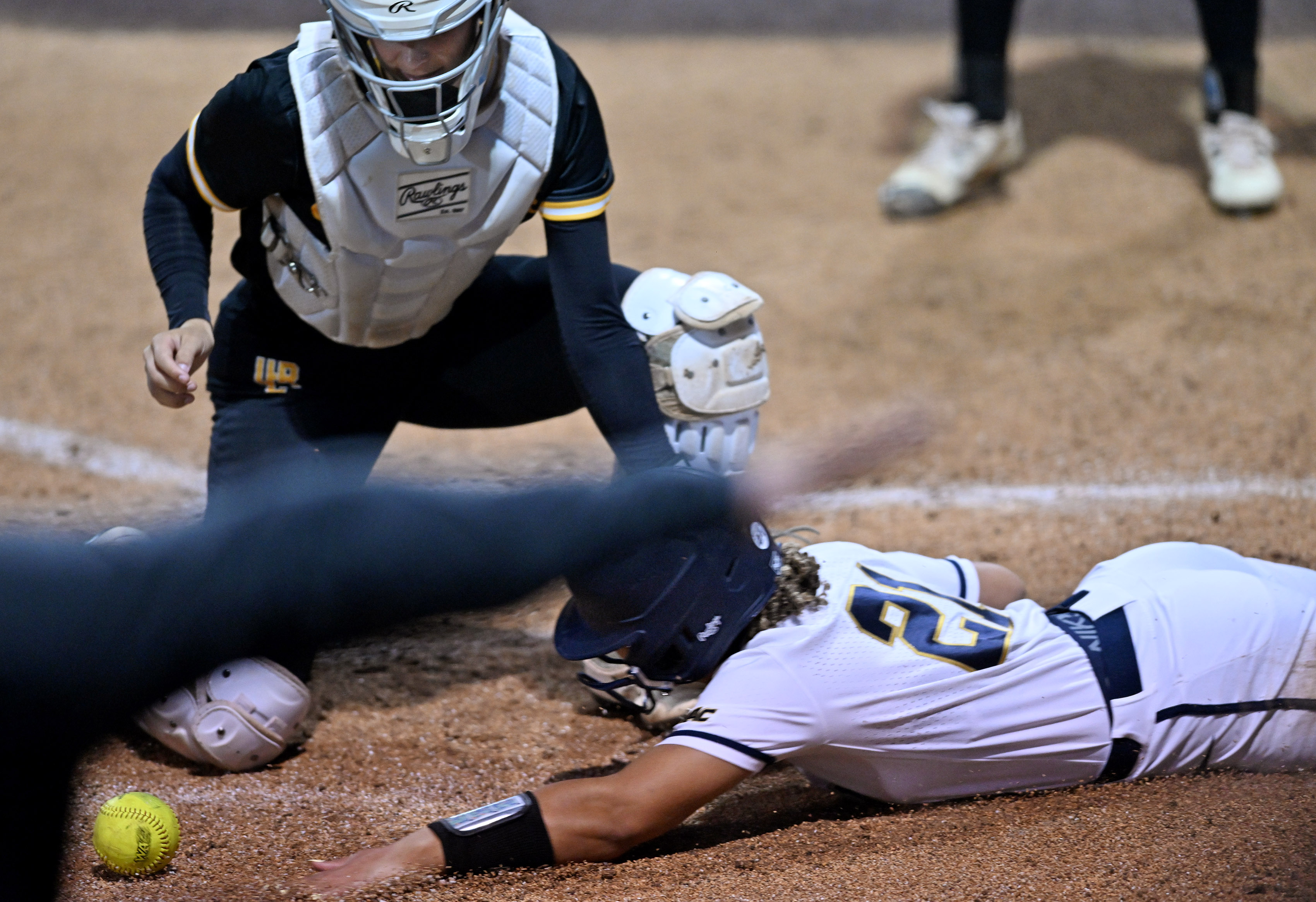California Baptist University’s Jasmine Goins slides to score against UC...