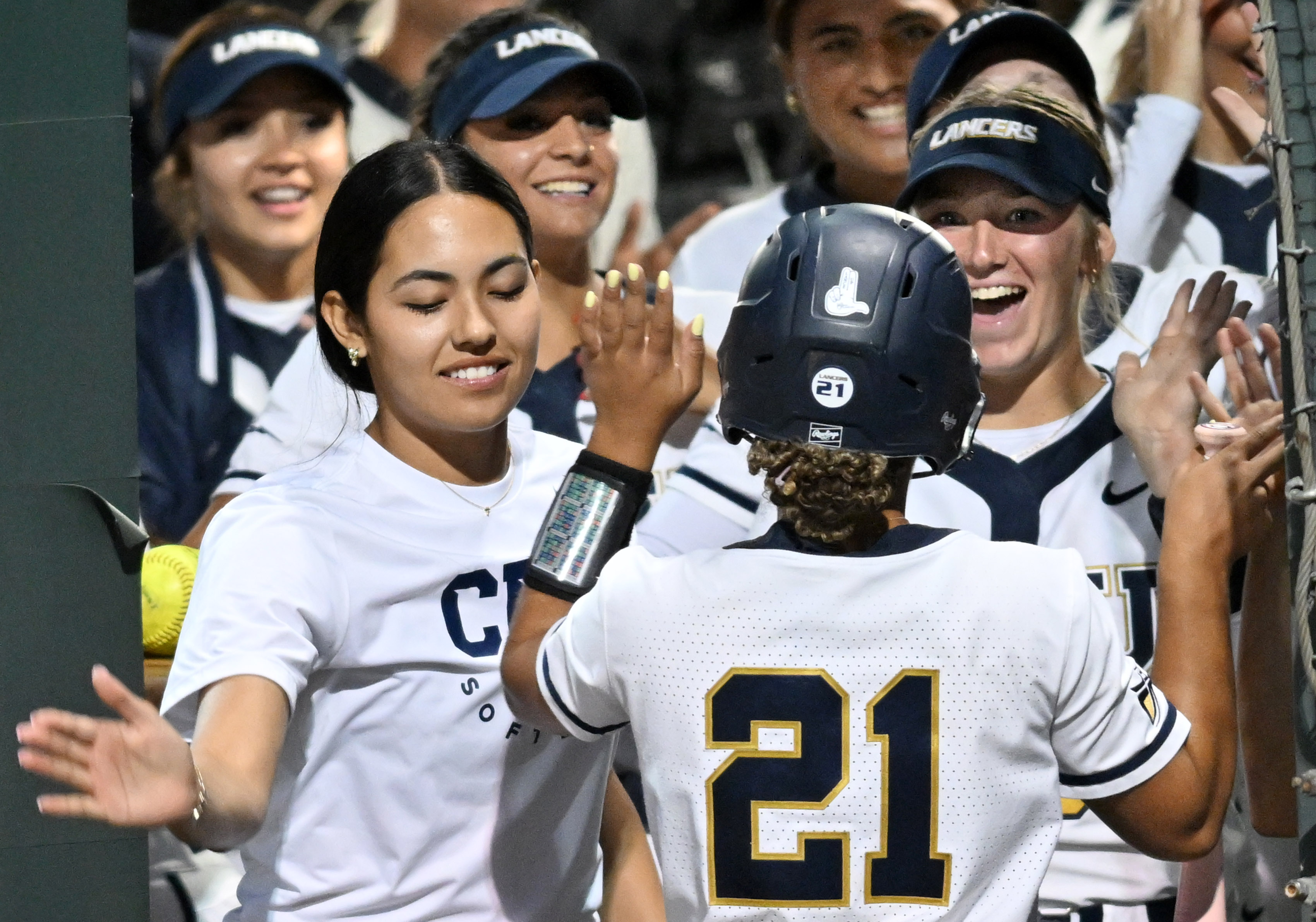 California Baptist University’s Jasmine Goins (#21) is congratulated by teammates...