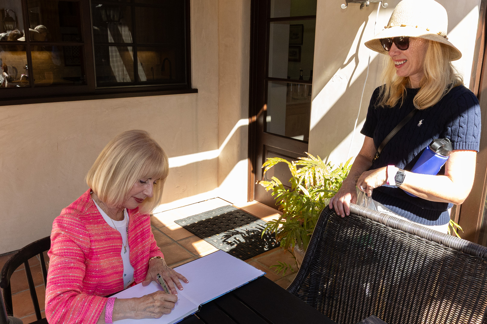 Author Diane Welch signs a copy of her book for...
