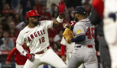 Los Angeles Angels' Jorge Soler (12) and Atlanta Braves' Reynaldo López (40) fight during the fifth inning of a baseball game, Tuesday, April 7, 2026, in Anaheim, Calif. (AP Photo/Ethan Swope)