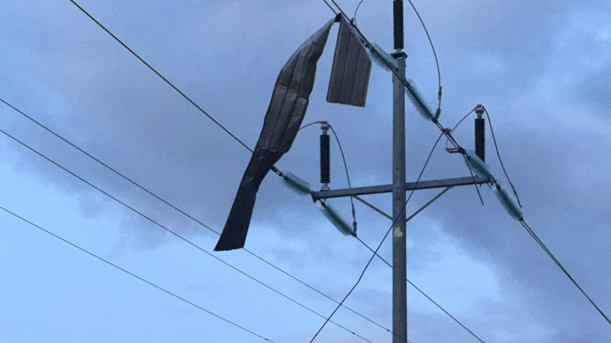 Roofing material twisted around a powerline after a EF-1 tornado touched down near Atwater, California on April 21, 2026