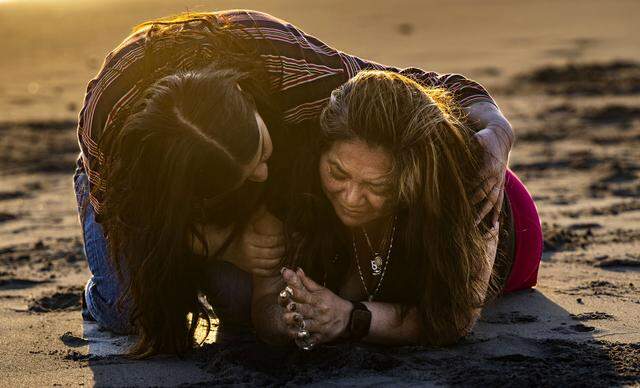 Maria de Jesus Estrada Juarez breaks down on the beach as she’s comforted by Ivonne Rodriguez, a press director working on immigration reform at FWD.US, in Rosarito, Mexico on Sunday, March 29, 2026. Estrada was overcome with emotion as she thought about her daughter, Damaris Bello, who witnessed her detainment by Homeland Security during an appointment in Sacramento.