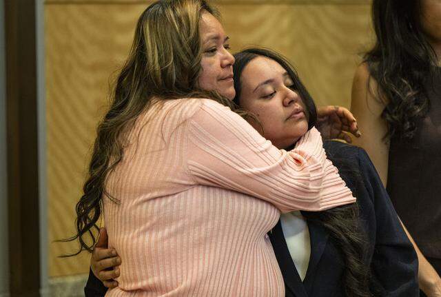 Maria de Jesus Estrada Juarez, a DACA recipient that was deported in February to Mexico, hugs her daughter Damaris Bello at Sacramento City Hall on Tuesday.